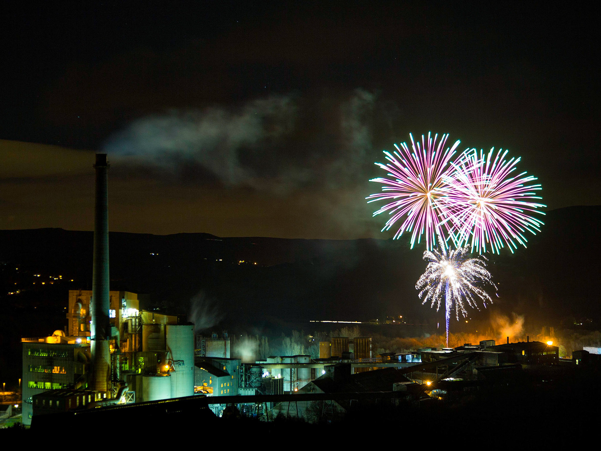 An unusual setting for a firework display, the cement works provides the backdrop for an impressive show.