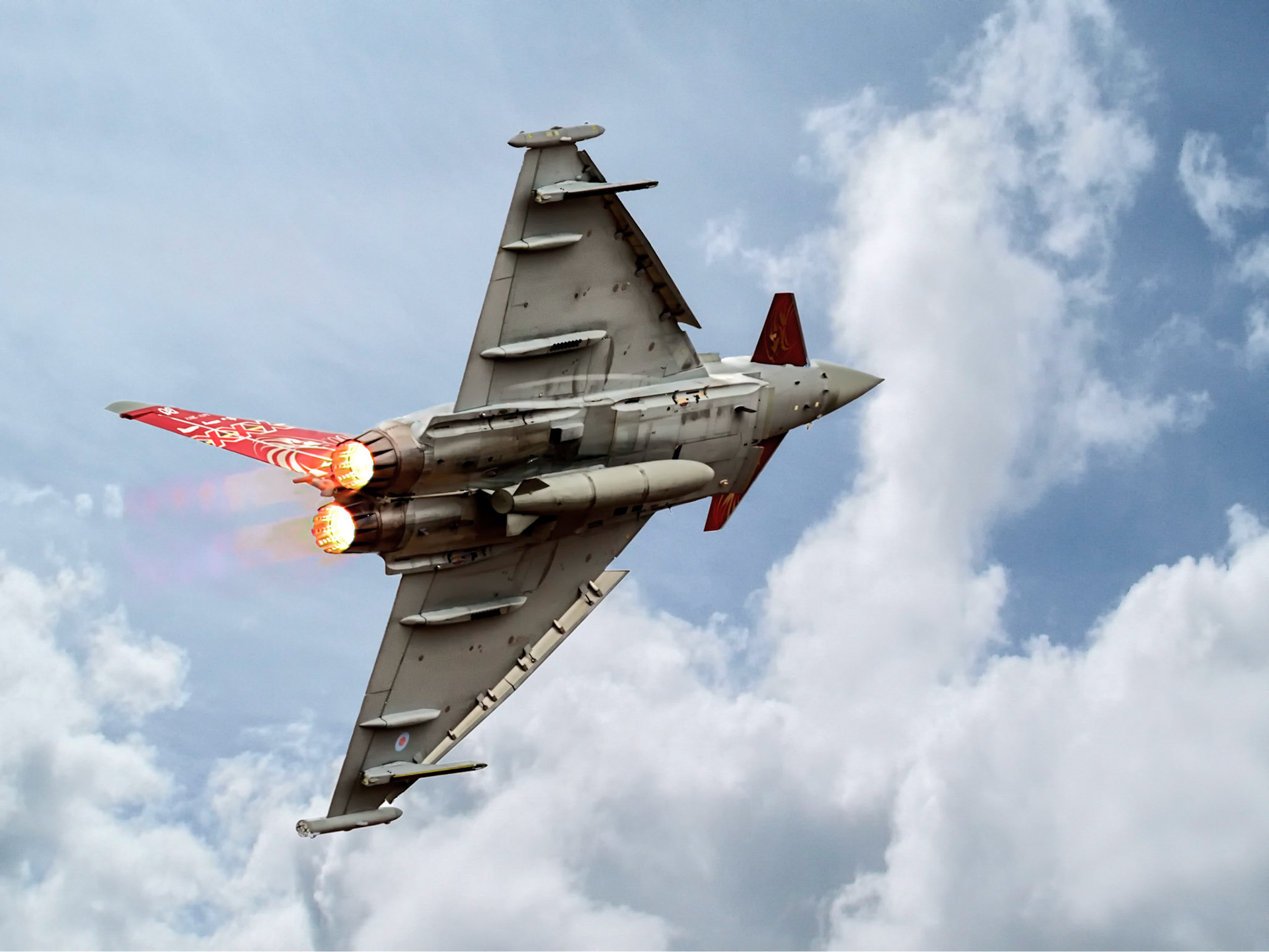 The Eurofighter Typhoon is a twin-engine, canard-delta wing, multirole fighter.  The aircraft was developed as a multinational collaborative effort between the UK, Germany, France, Italy and Spain. Because of disagreements over design authority and operational requirements, France left the consortium to develop the Dassault Rafale independently instead.  The name of the aircraft, Typhoon, was formally adopted in September 1998; the first production contracts were signed that same year.