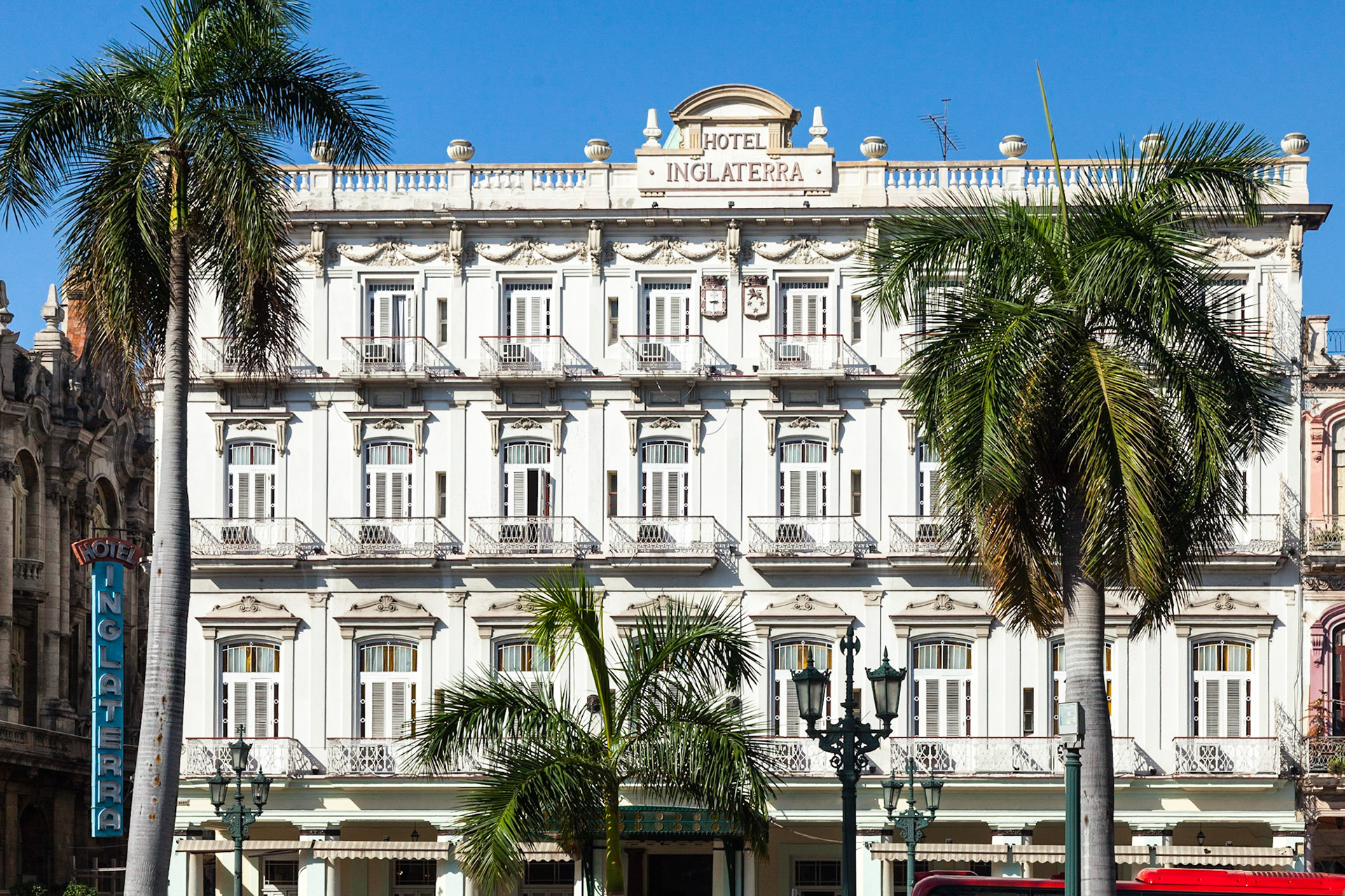 The Hotel Inglaterra has a beautiful neoclassical façade across Parque Central with its statue of Jose Marti. The Hotel Inglaterra is the oldest hotel in Cuba, inaugurated in 1875. The interior of the Hotel Inglaterra has an extravagant crystal chandelier, mosaic tile lobby, stained-glass windows, Spanish heraldic symbols, window grills, and intricately worked ceilings.