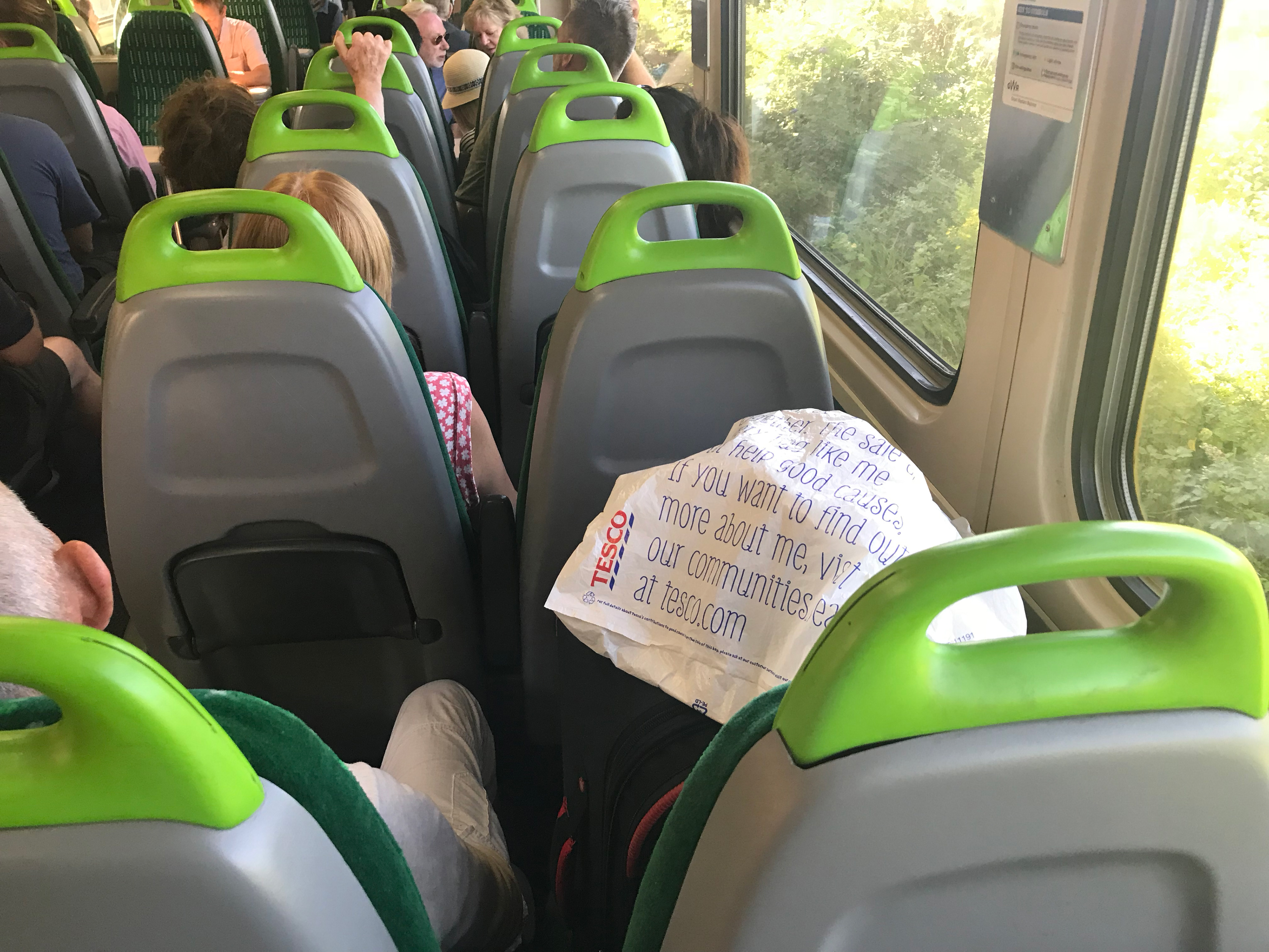 Even on a full train shopping bags still take priority