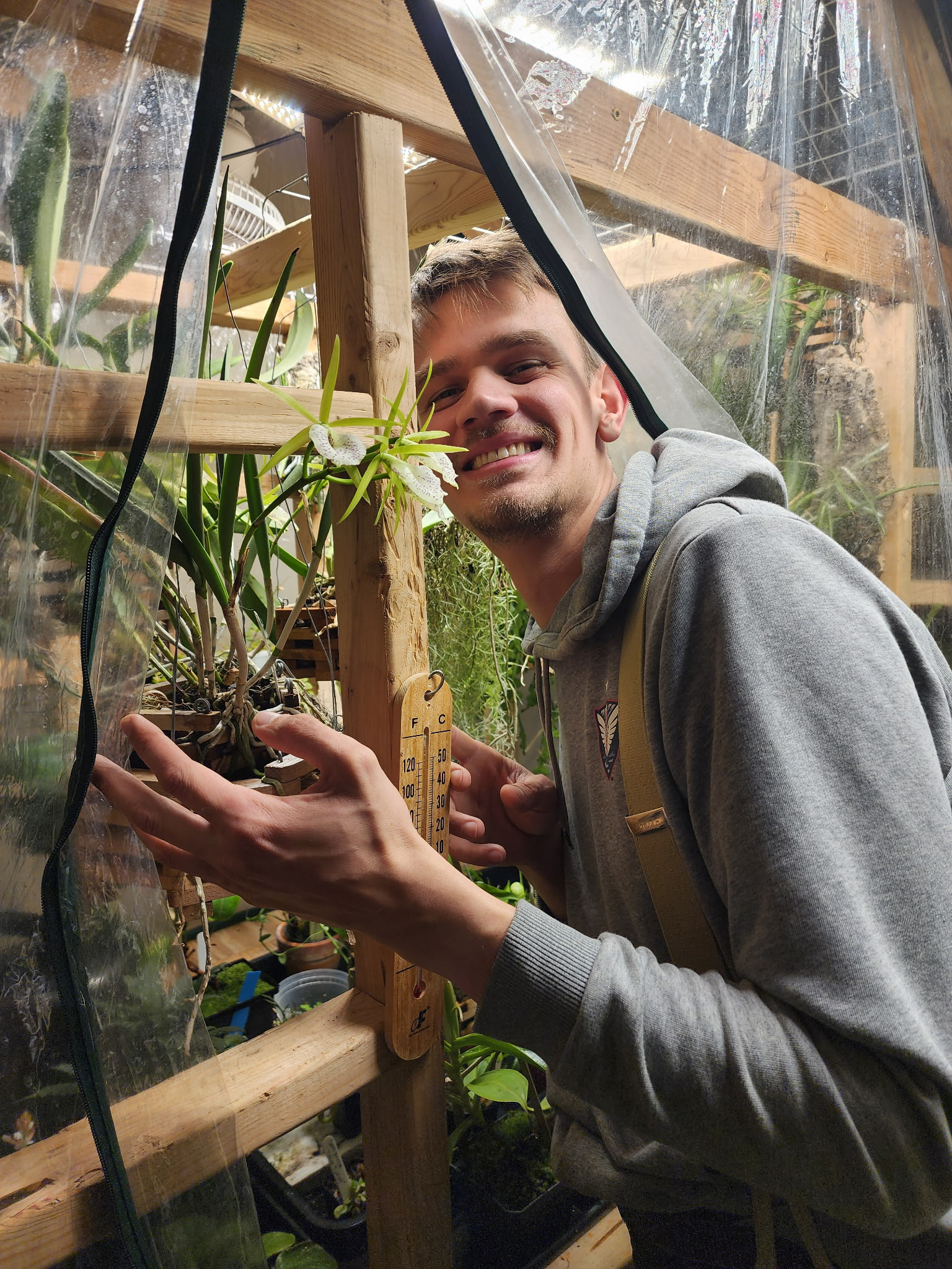 Whitt with one of his orchids