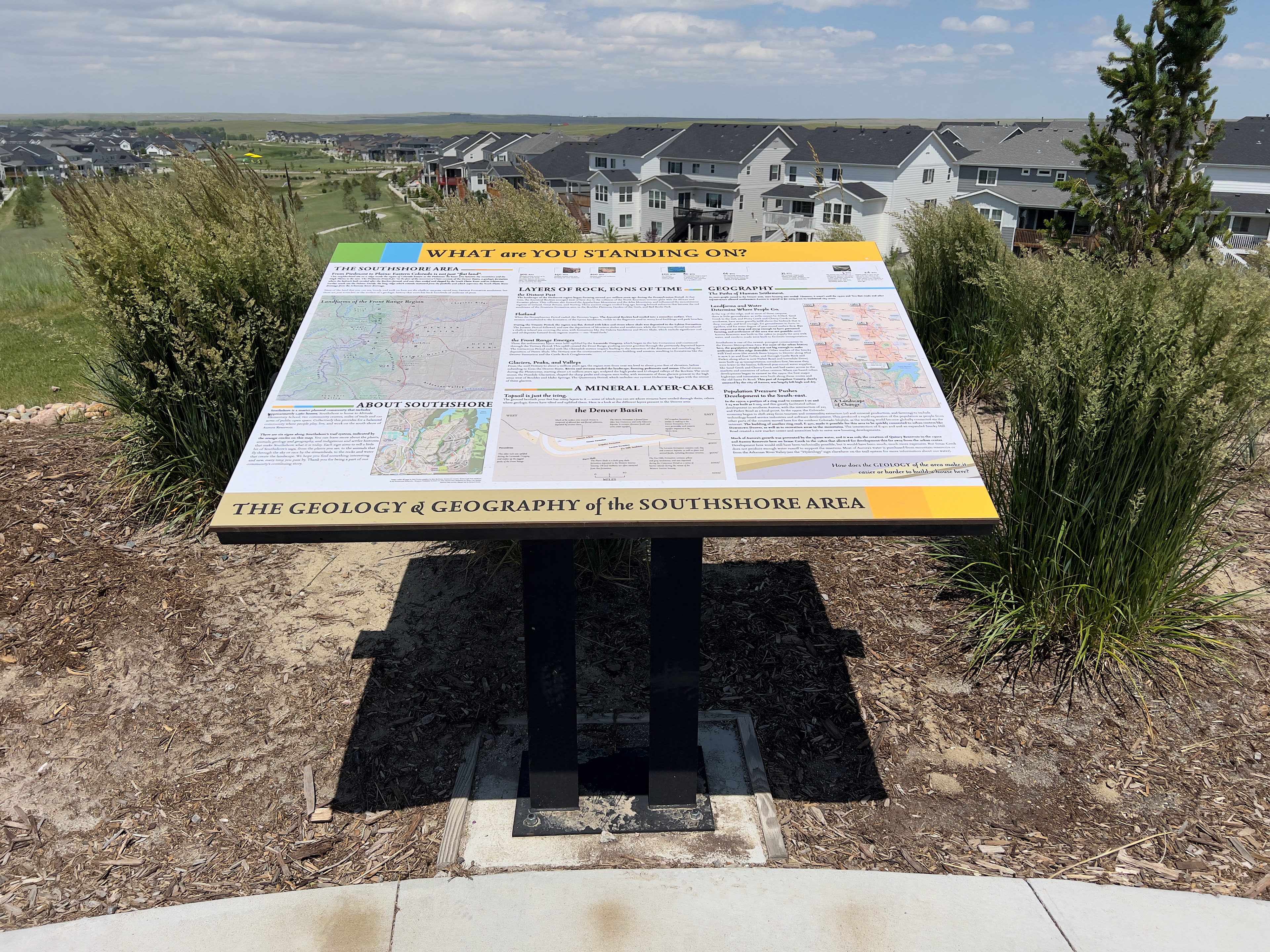 Overview of a sign about Southshore's geology and geography, titled "What are You Standing On?" The sign has several customized maps made for this project, and a diagram of the geology underlying the Denver Basin area.