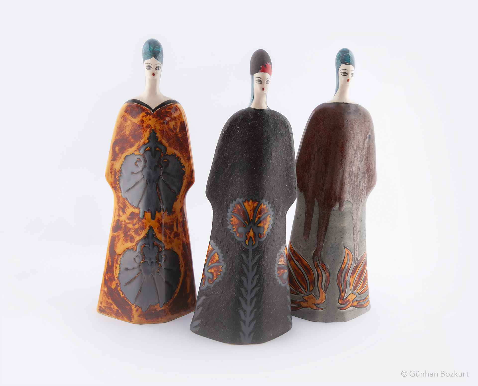 Women Figures in Kaftans / ceramic sculptures, each h. 38 cm, w. 13 cm