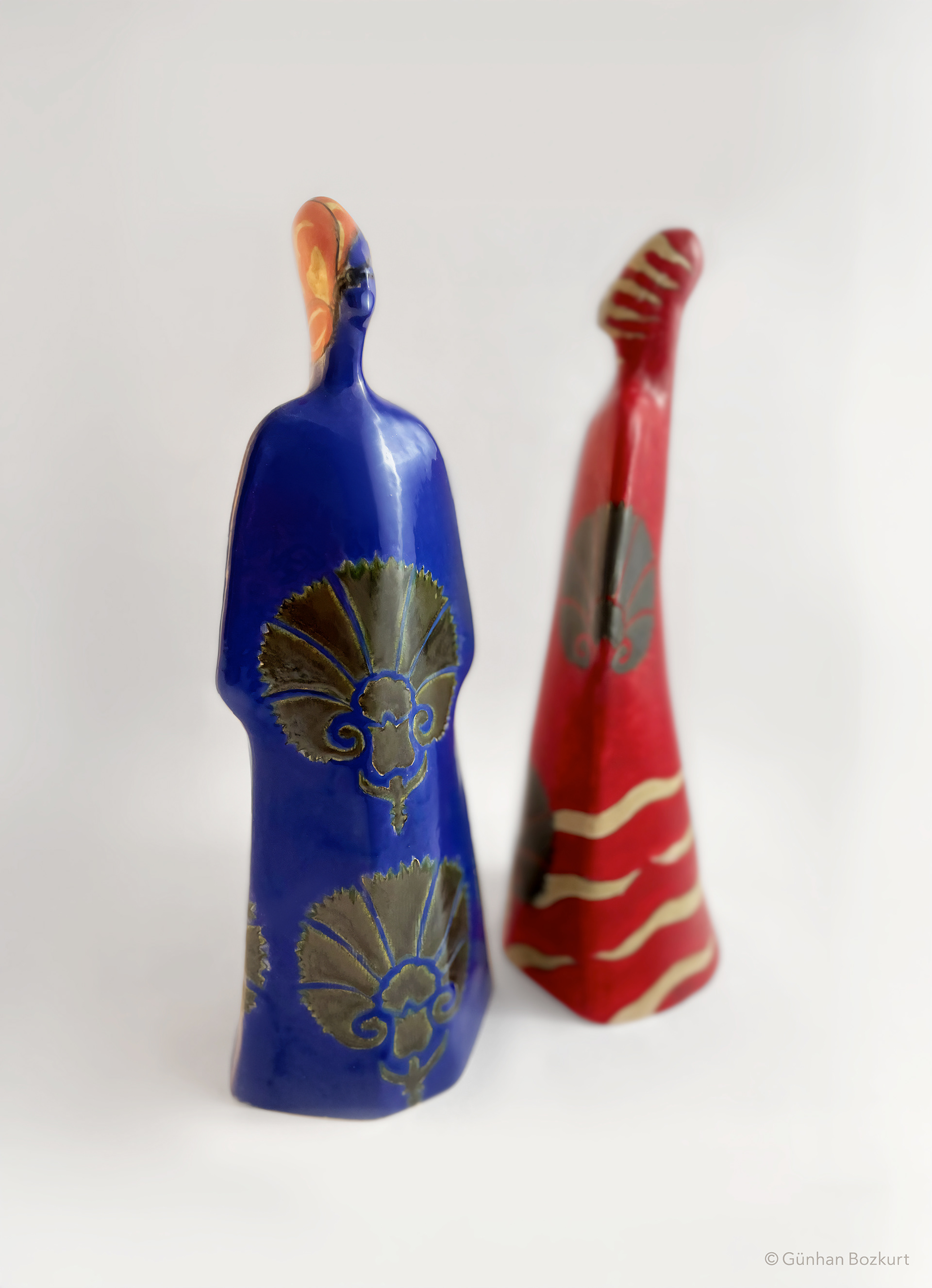 Women Figures in Kaftans / ceramic sculptures, each h. 38 cm, w. 13 cm
