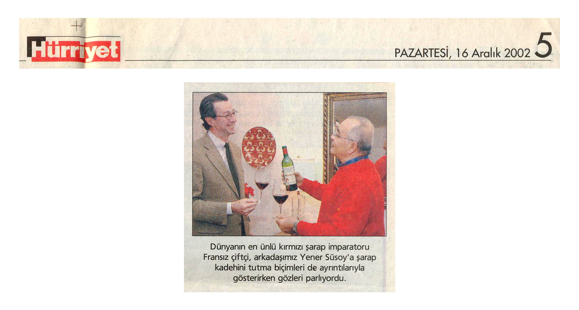 Hürriyet, December 16, 2002 – artwork in the background (Hürriyet newspaper)