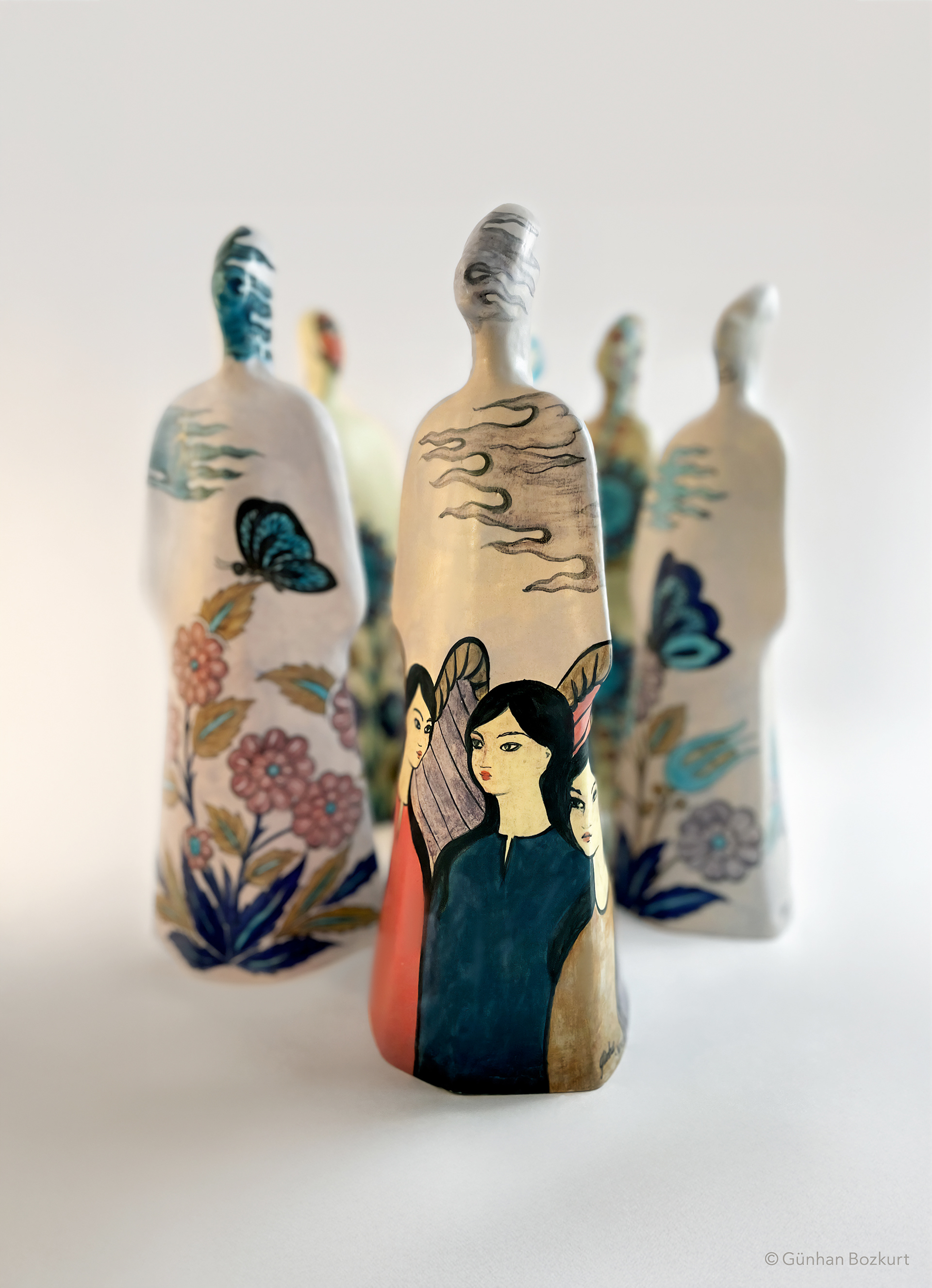 Women Figures in Kaftans / ceramic sculptures, each h. 38 cm, w. 13 cm