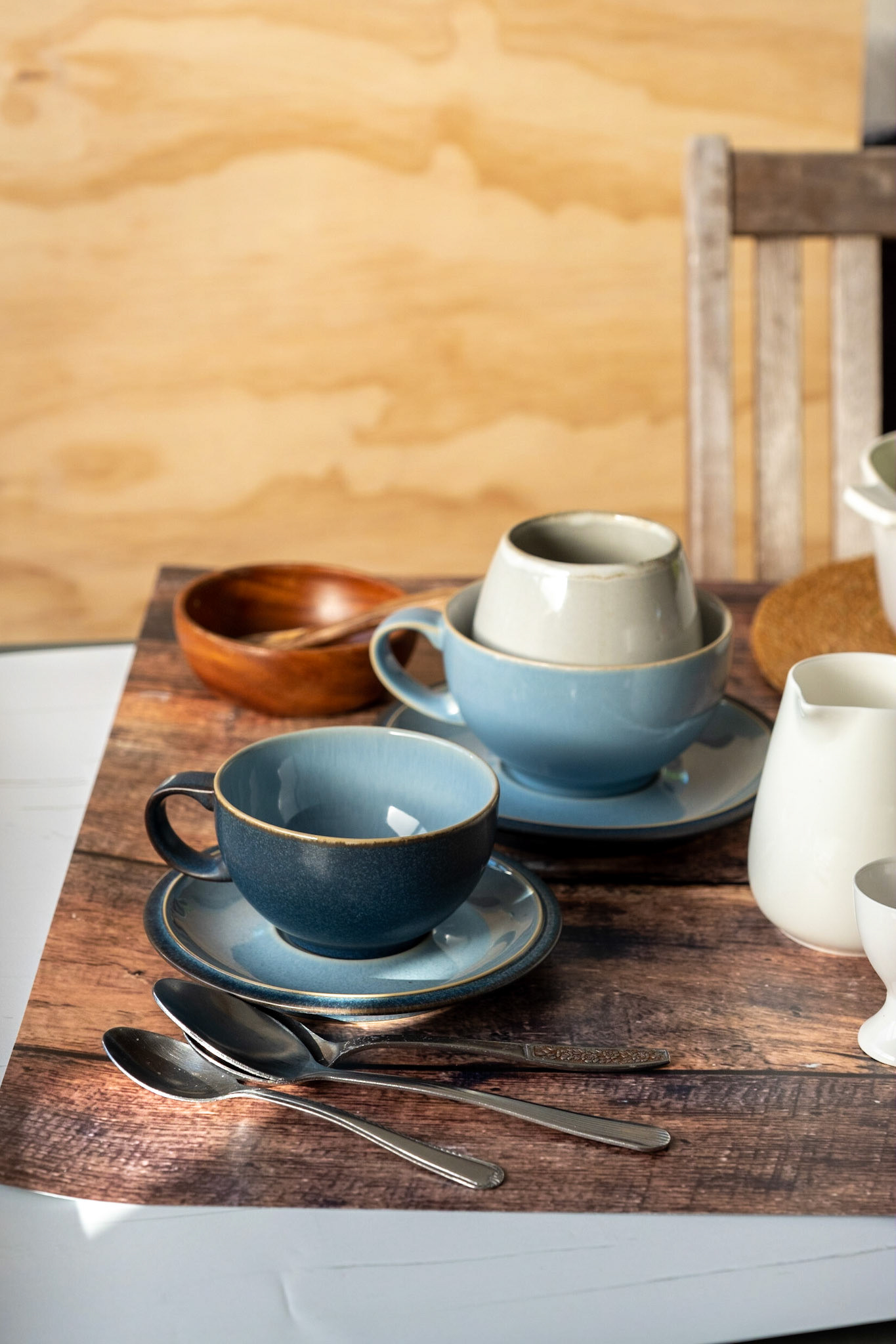 Gathering props for food photography using rustic table vinyl backdrop from CM Backdrops NZ
