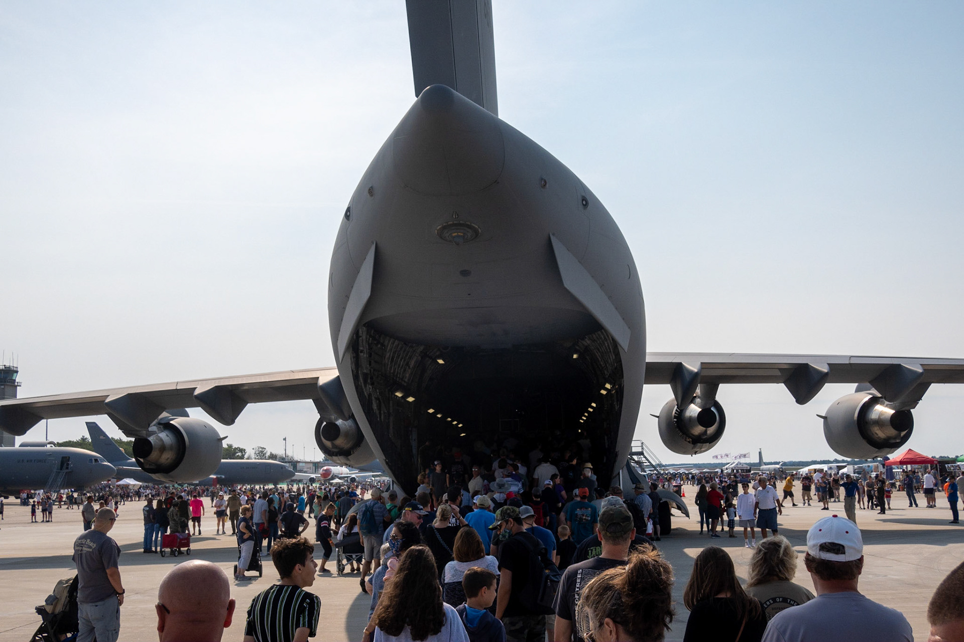 C-17.  This exact plane was used to help with the Afghan evacuation.  Up to 800 people were seated on the floor.