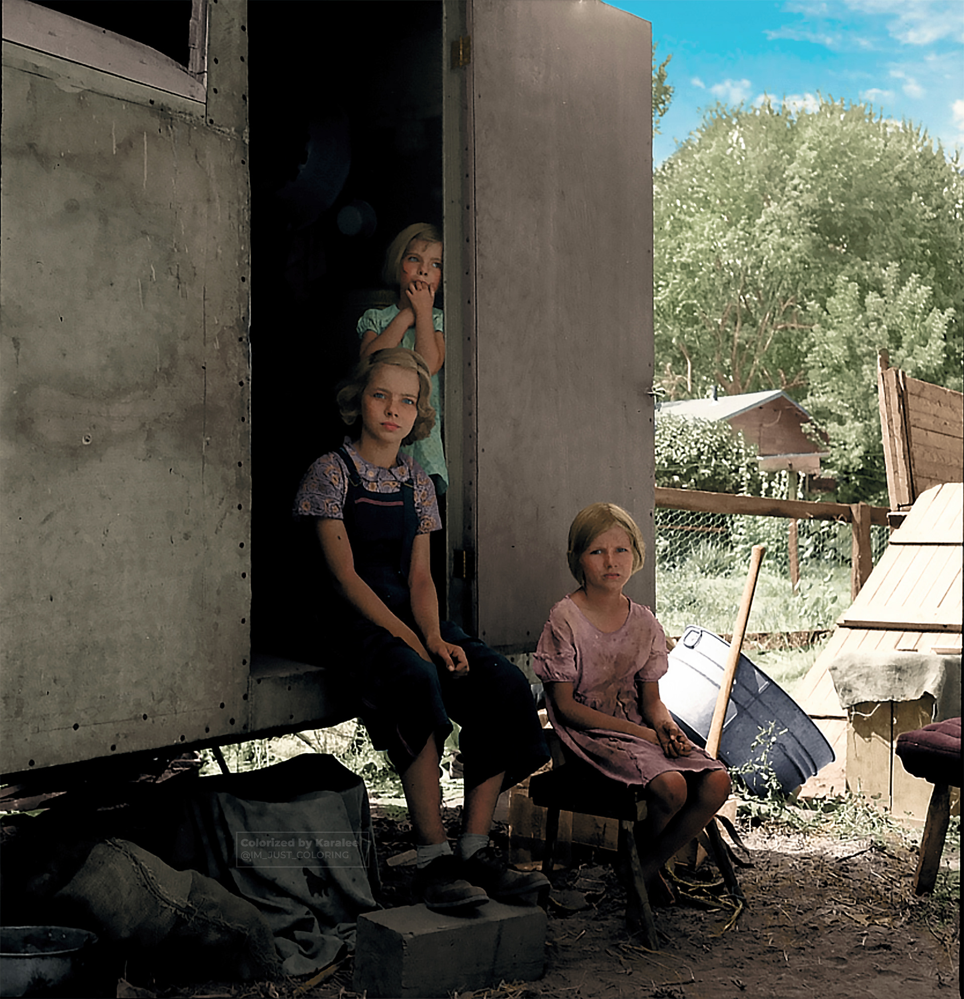 “The oldest girl seated in the doorway of the house trailer cares for the family. Yakima Valley, Washington” 📸 Dorothea Lange, 1939 Aug.  Original image from @librarycongress