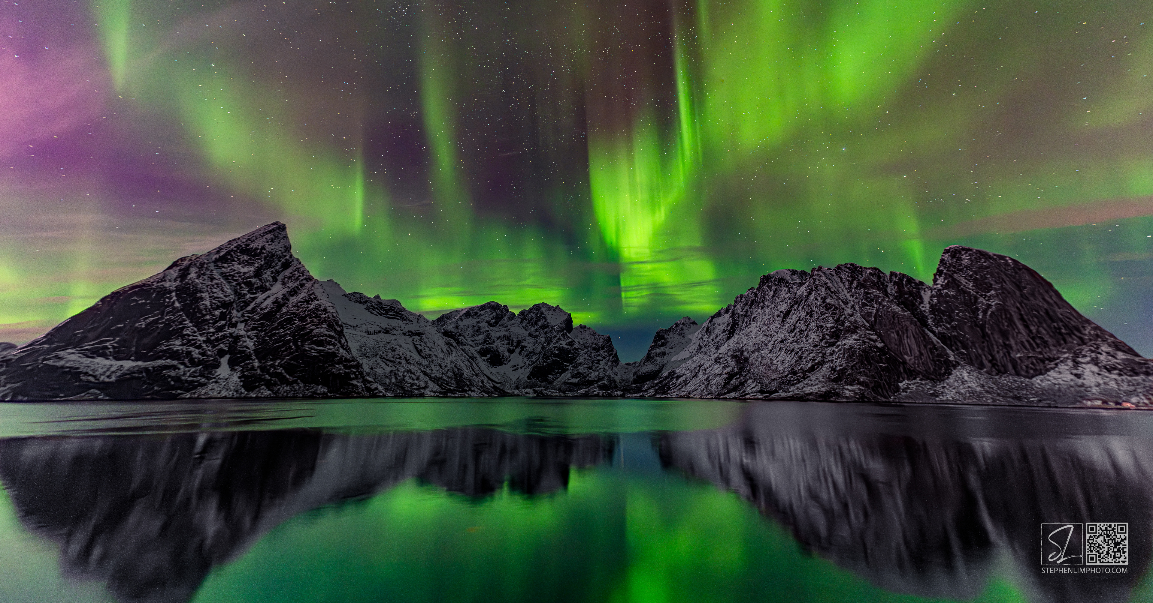 Aurora Storm:  Reflection of a raging aurora & mountainscape