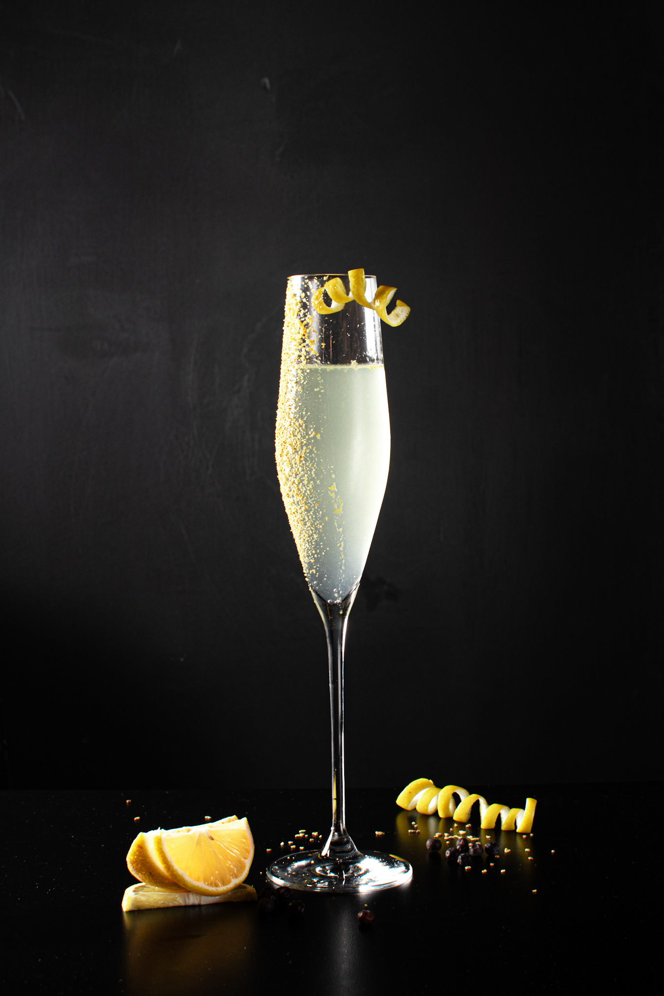 lemon drink in a champagne glass, black background