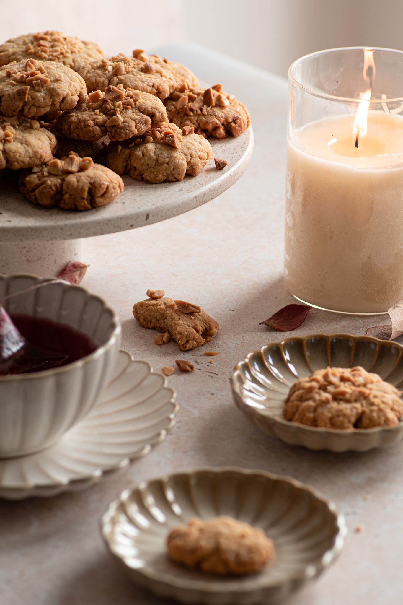peanut cookies, tea and candle