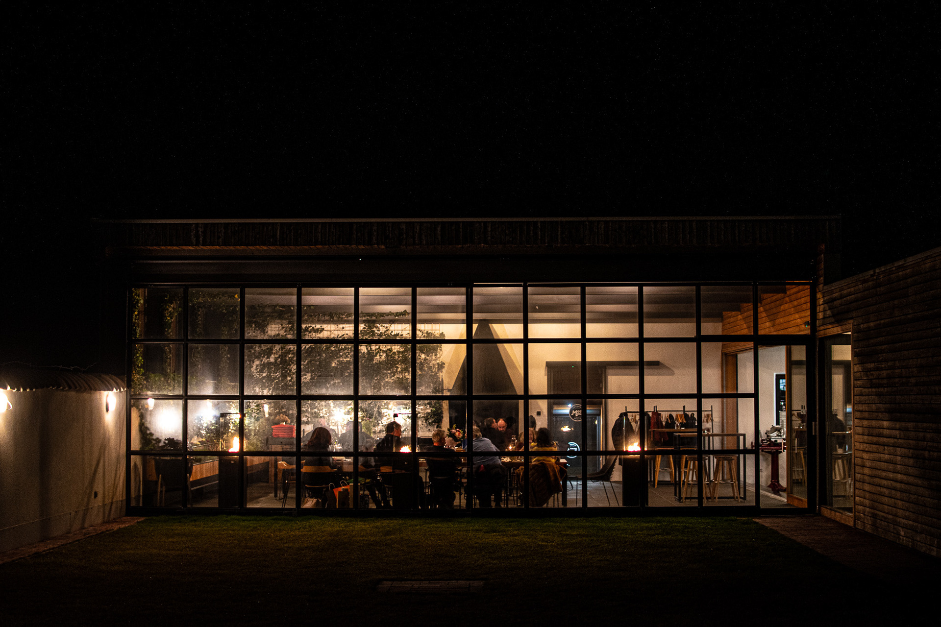 restaurant evening vibe through the terrace window in the dark