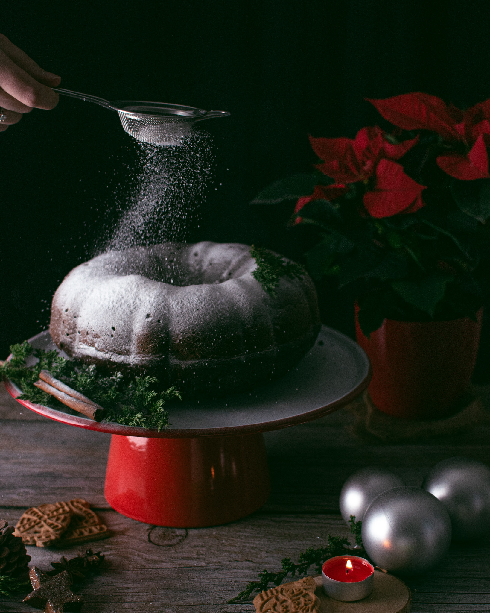 vintage image of a christmas pound cake with sugar and poinsettia