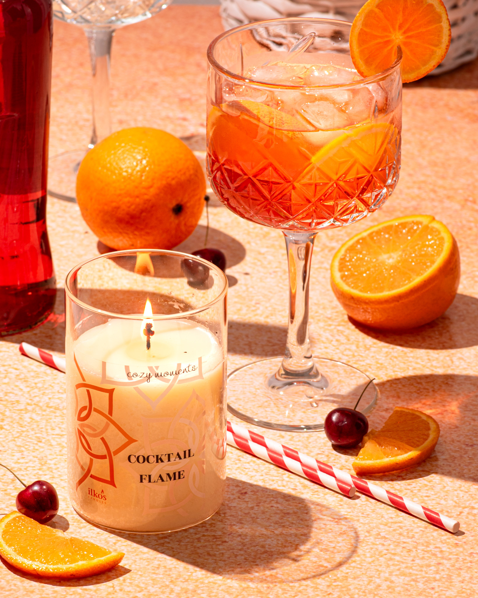 aperol spritz, oranges and candle