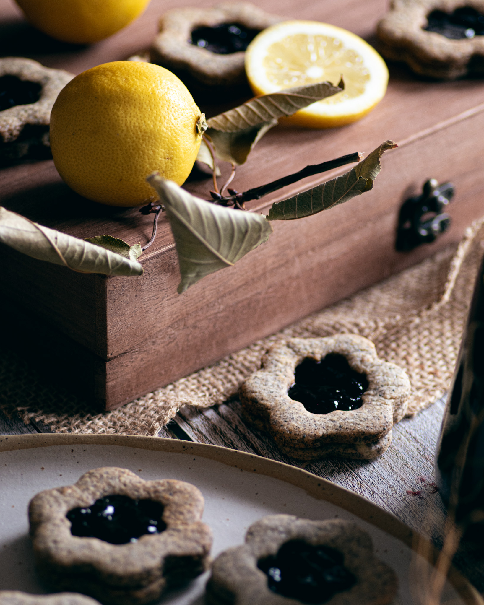 lemon, wooden box, flower shaped linzer cookies