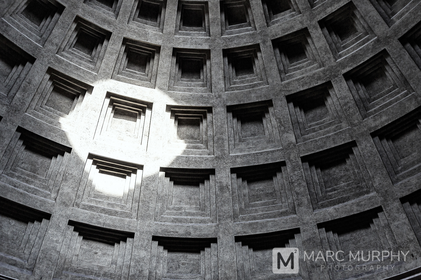 Black and White Abstract of the Round Coffered Ceiling of The Pantheon in Rome Italy with the Sun Making a Spotlight on the Ceiling
