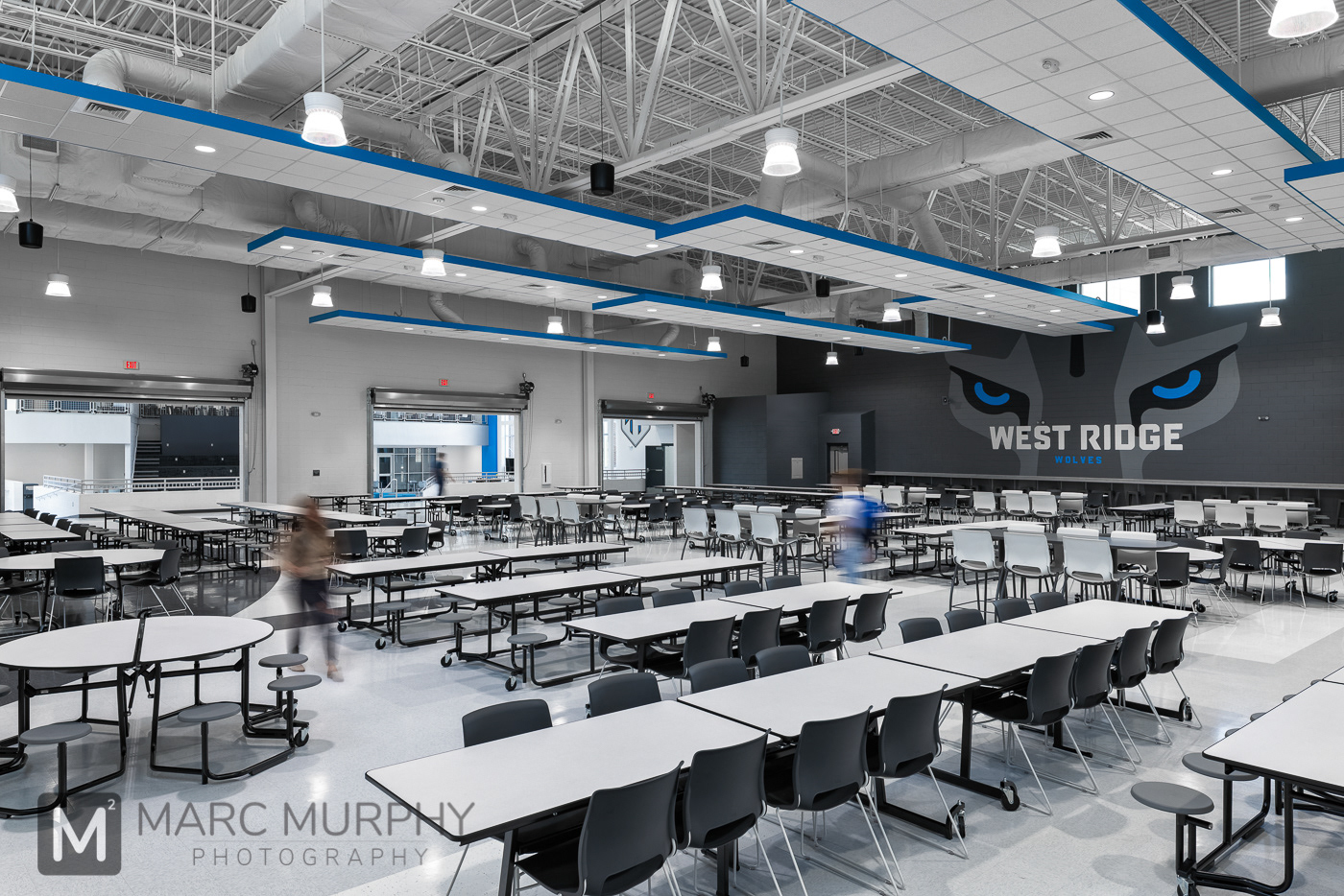 West Ridge High School Cafeteria with lights, tables and chairs