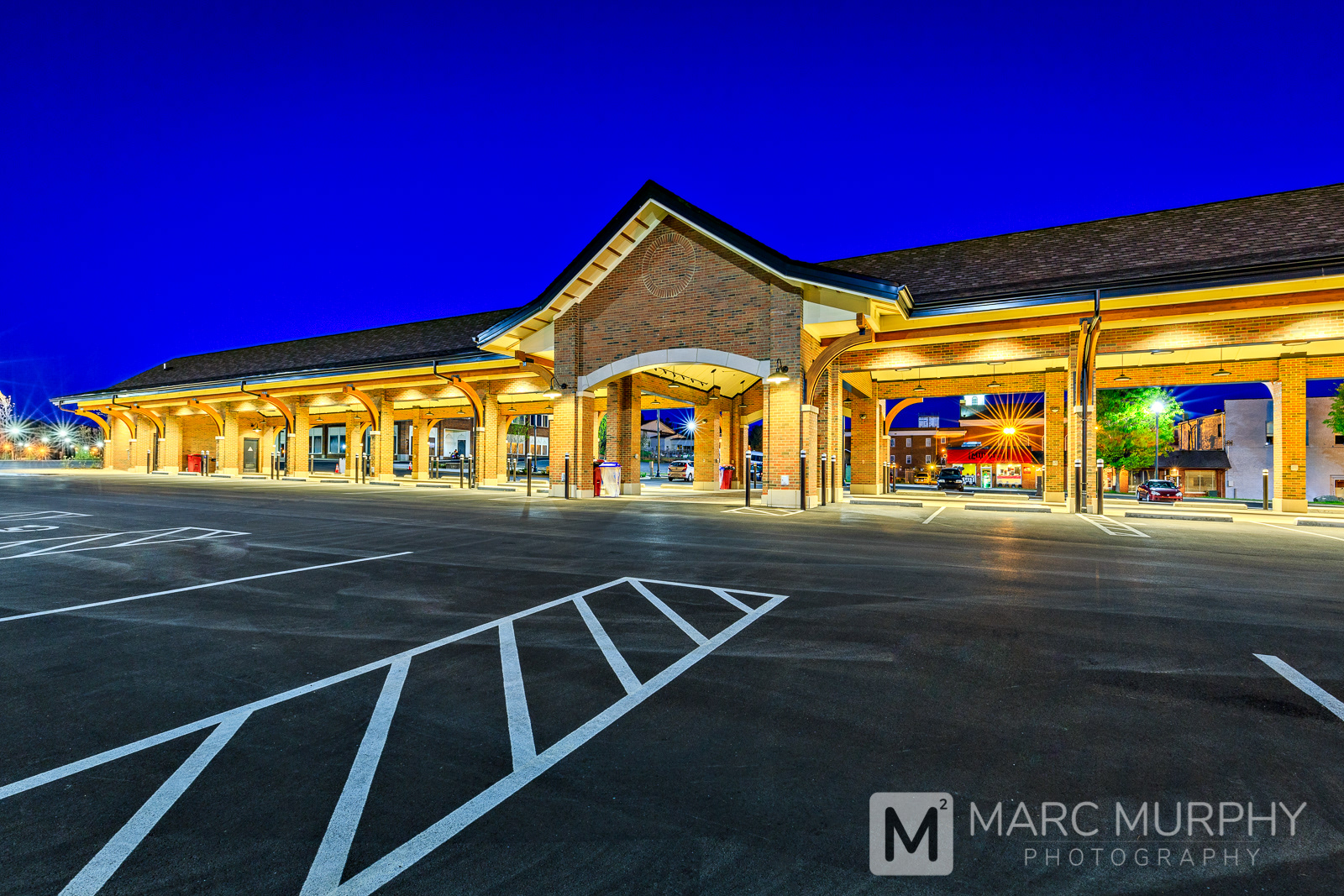 Brick and Wood Pavilion Farmers Market Exterior with Shingle Roof at Night in Downtown Johnson City Tennessee