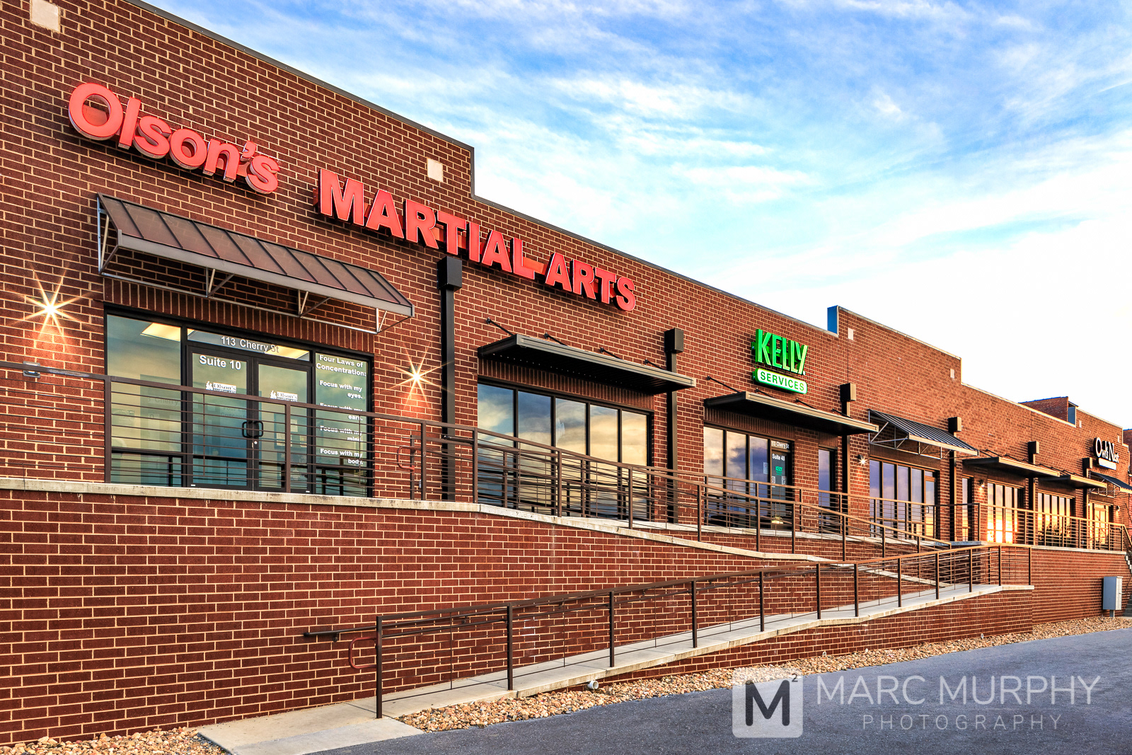 Downtown Johnson City Tennessee Cherry Street Commons Brick Retail Shopping Center at Sunset with Sidewalk Ramp and Railing