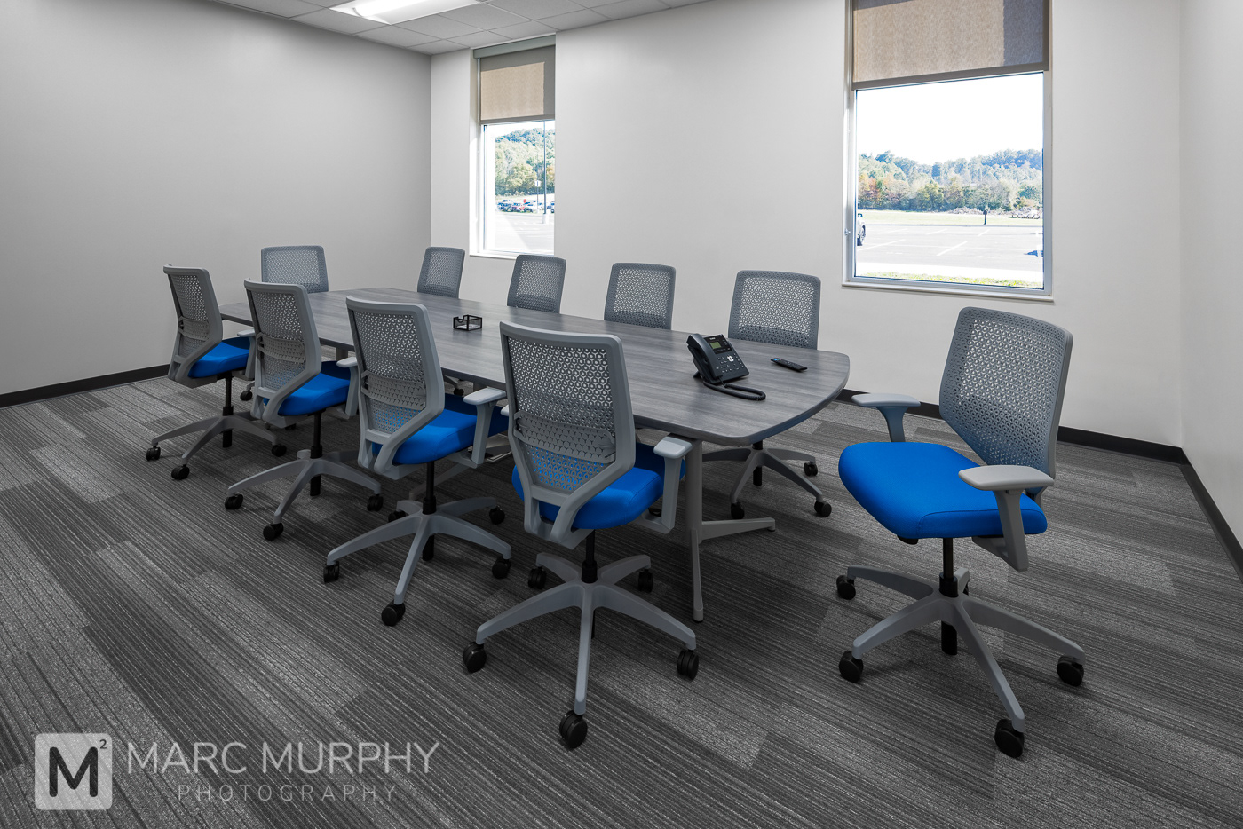 West Ridge High School Administrative Conference Room with conference table, chairs, telephone and windows