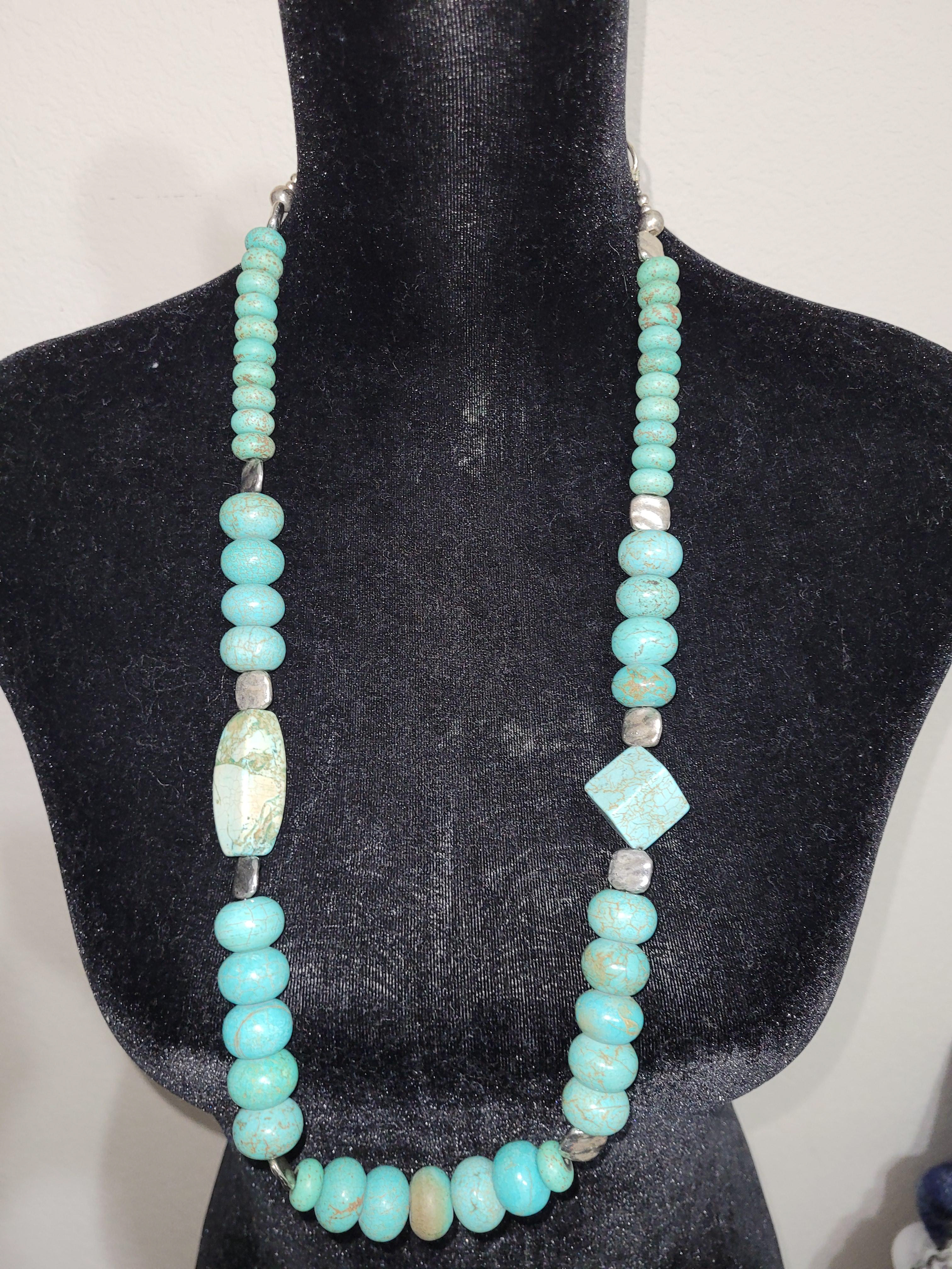 Magnesite multi shaped beads with silver beads 36 inch long  $65