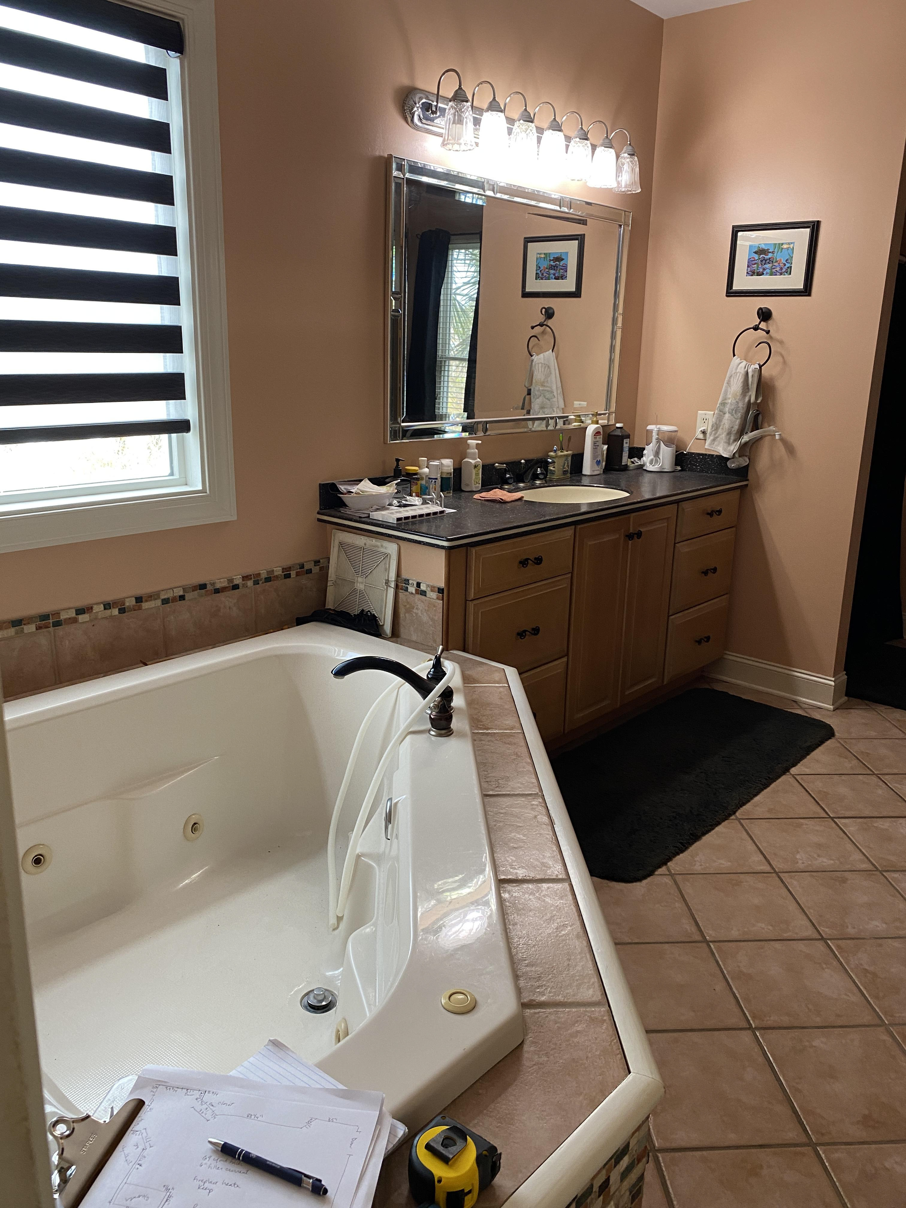Remove wall, tub, move vanity & add linen closets