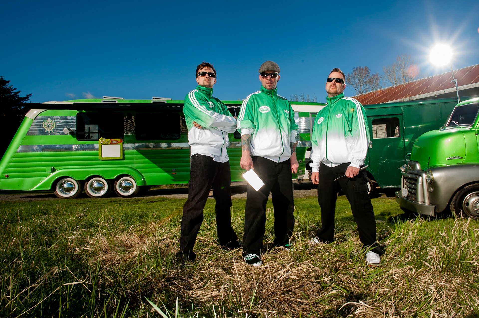 Green Machine Catering were pitching themselves to the Food Network and I was lucky enough to photograph their promo piece.  The original idea was to photograph them with these vehicles in an old car junk yard, but once we got to the yard we realized these huge beutiful trucks were not going to fit in the narrow rusty lanes left for us, so we had to make a new plan.  We moved to this location and worked as best we could we the strong light of the day.  Nikon D3, 18mm, Pocket Wizards and a variety of strobes ranging from a Photofoto 7B to a Speedotron 1205 and some other small flashes. 2011.
