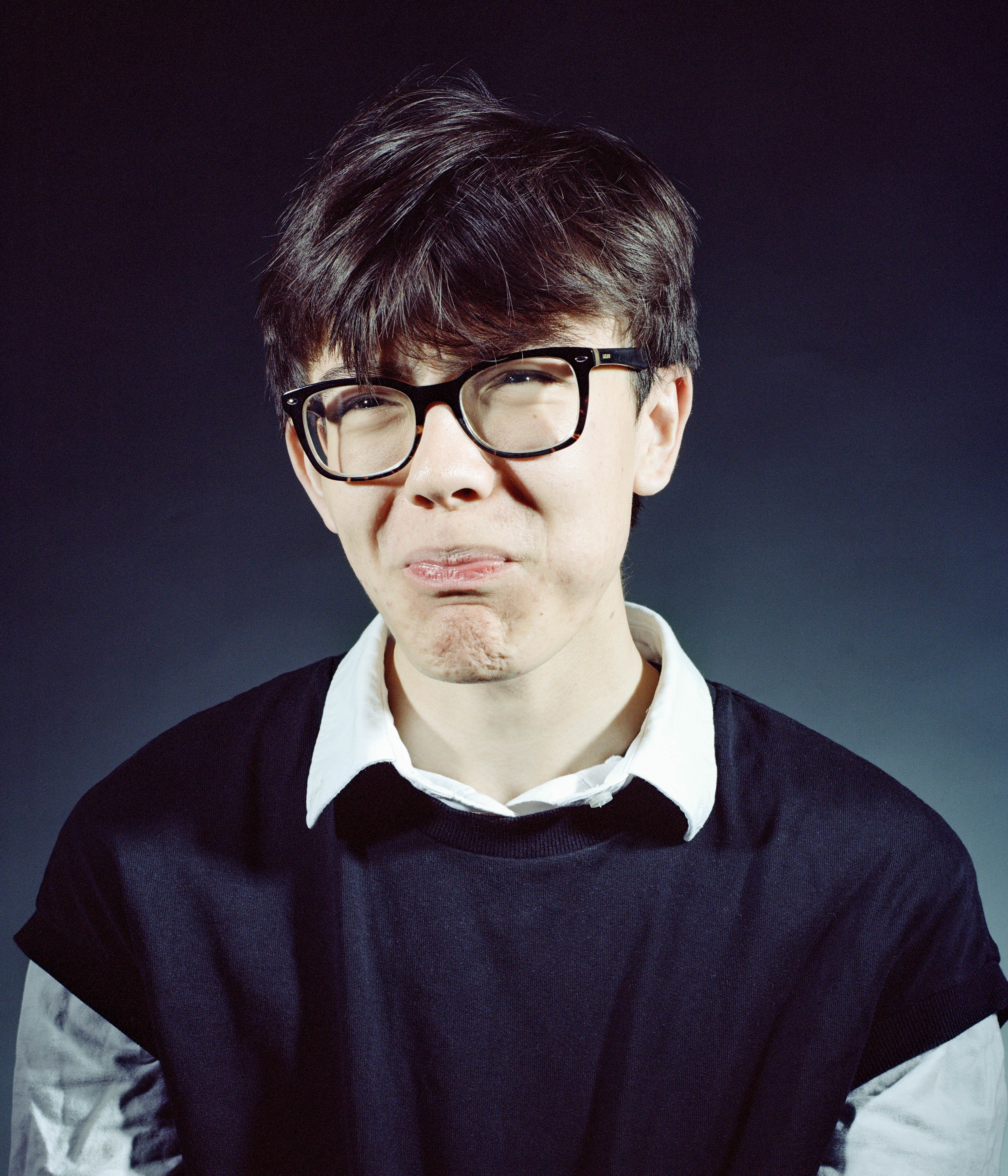 medium format film portrait, male looking uncomfortable 