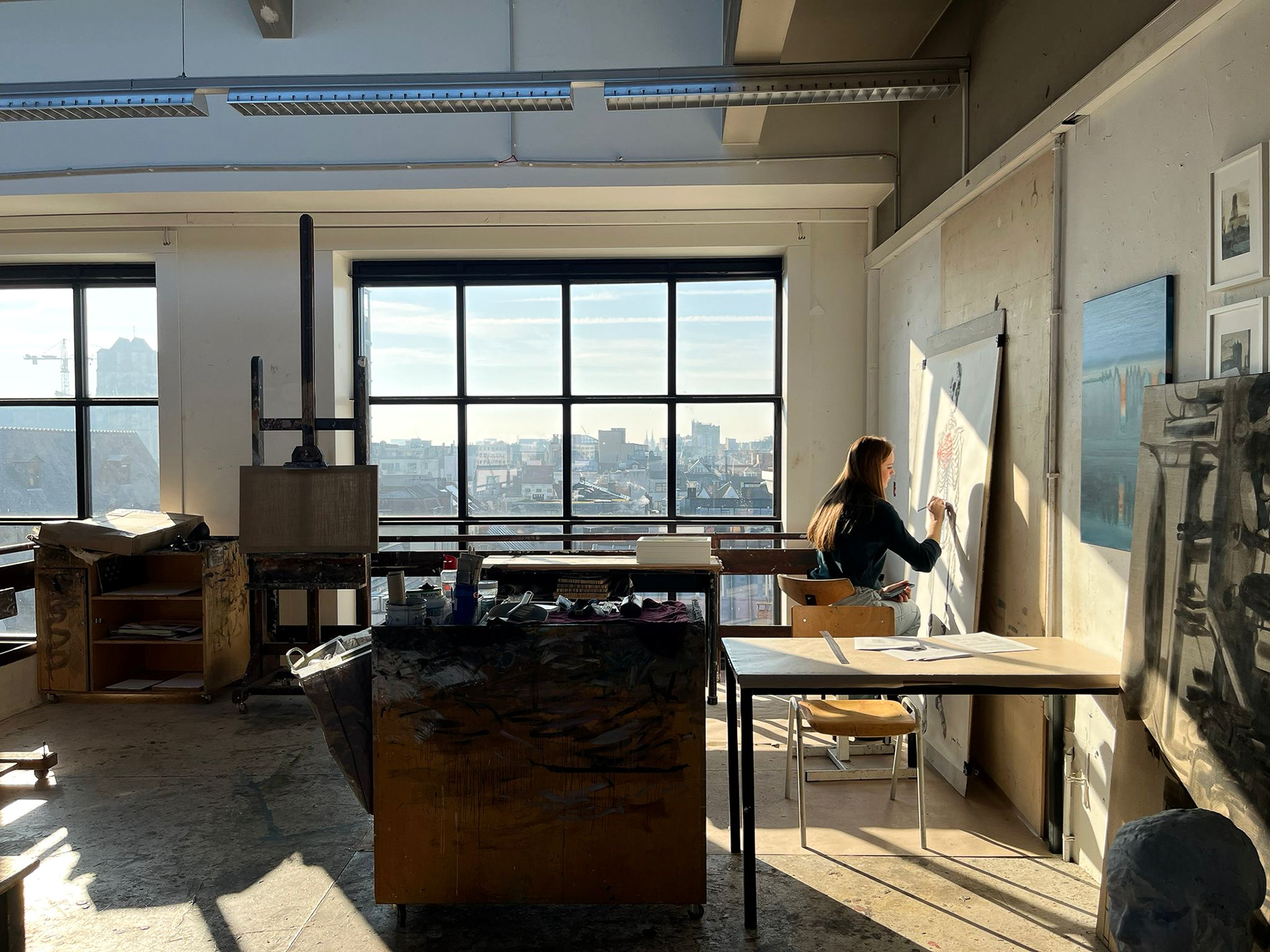 Giovana Tows working on a charcoal drawing in the painting studio of the Royal Academy of Fine Arts in Antwerp - Belgium, 2025.