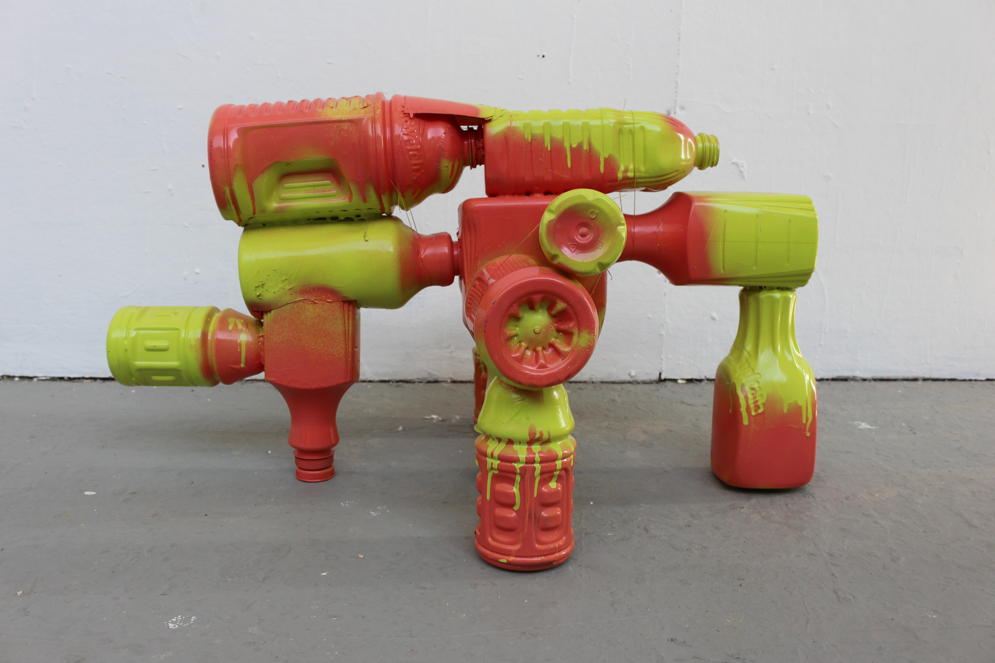 Plastic bottles, fishing line, hot glue, and spray paint.