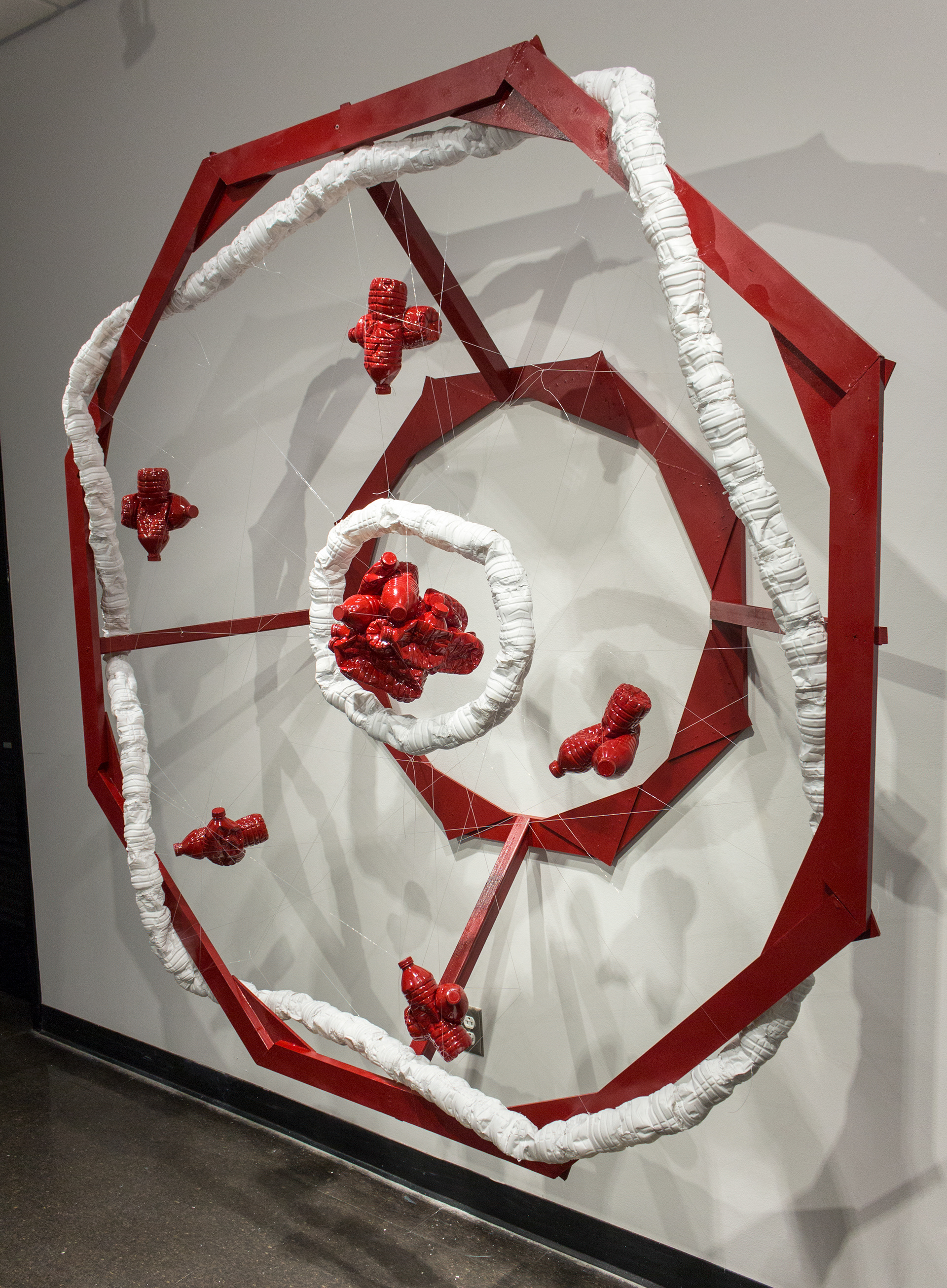 A Fantastic Mess (2016) - Wood, water bottles, spray paint, and fishing line, exhibited at the List Art Center.