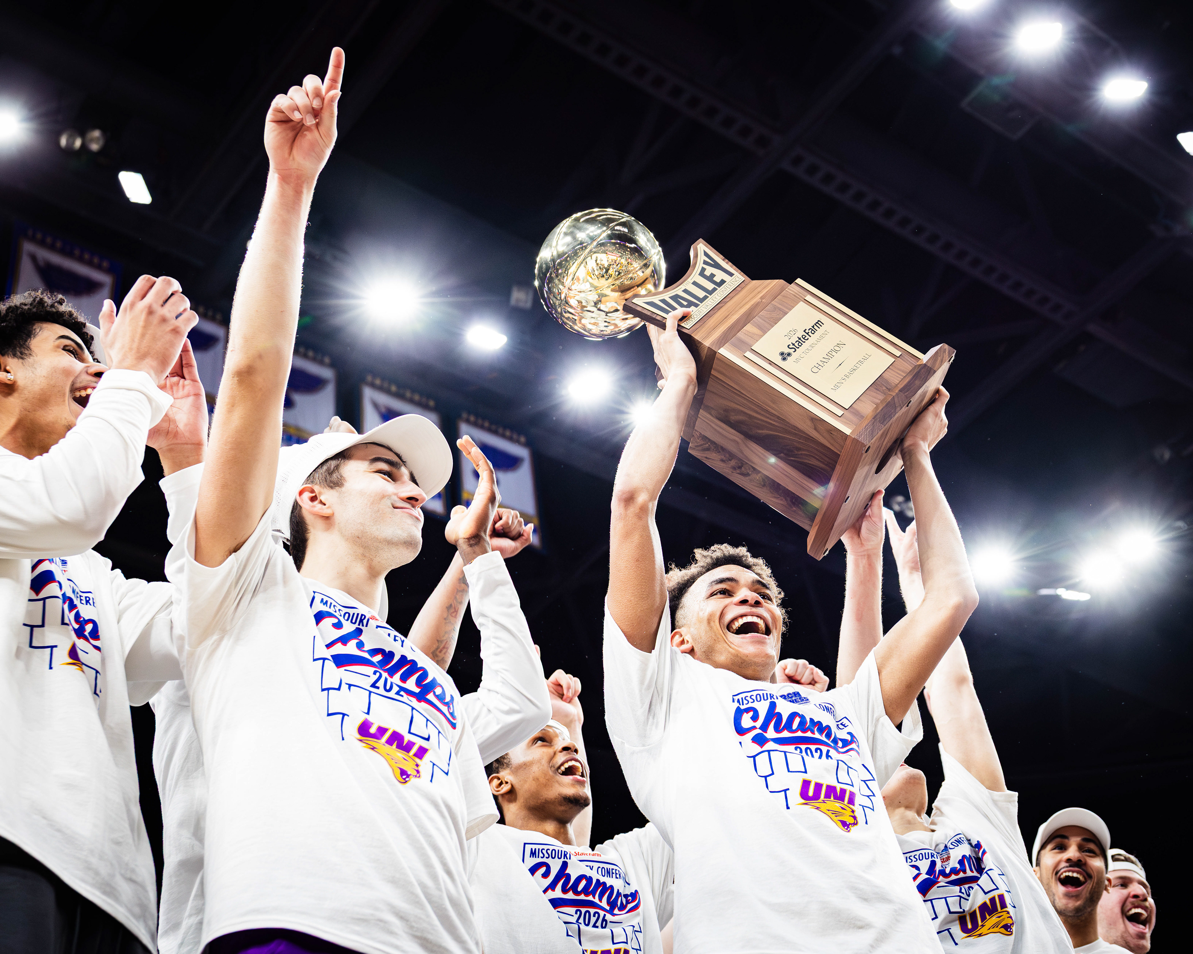 UNI basketball player Trey Campbell hoists the Missouri Valley Conference Championship trophy after winning the title game against UIC, at the Enterprise Center, located at St. Louis, Missouri, on March 8, 2026. 