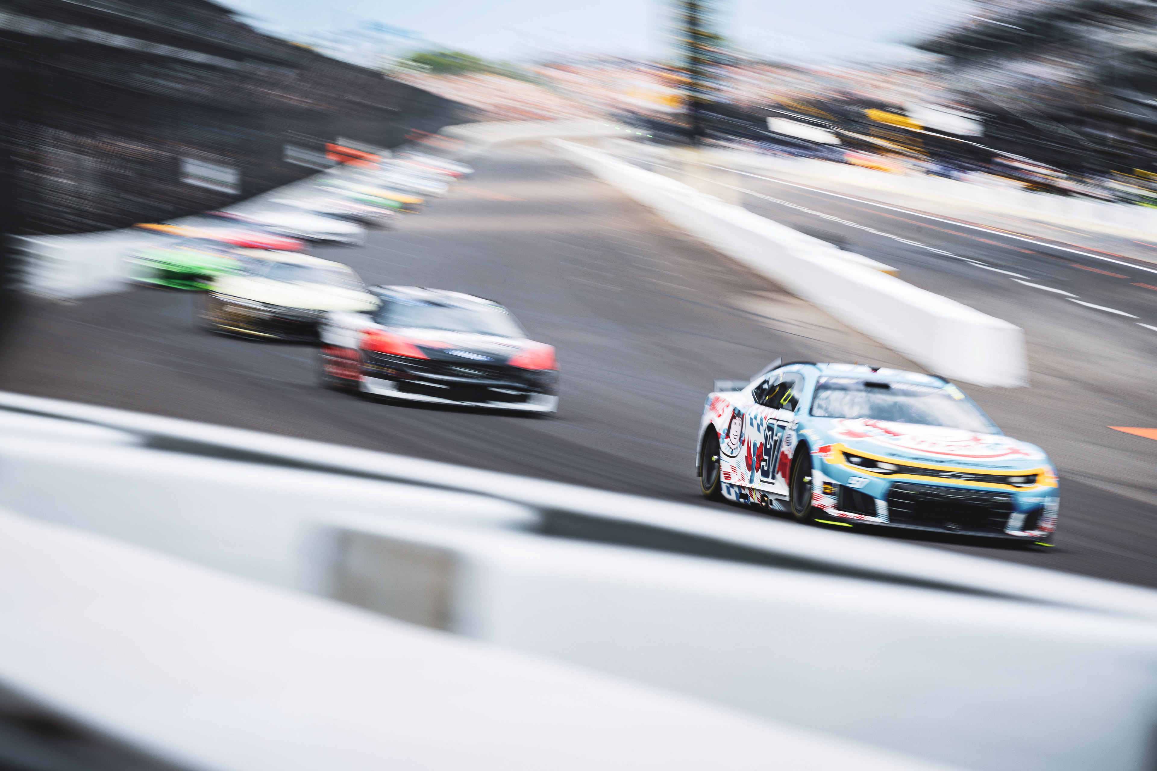 Shane Van Gisbergen, driver of the No. 97 Chevrolet for Trackhouse Racing, races into Turn 1 at the Indianapolis Motor Speedway during the Brickyard 400 on July 26, 2026.