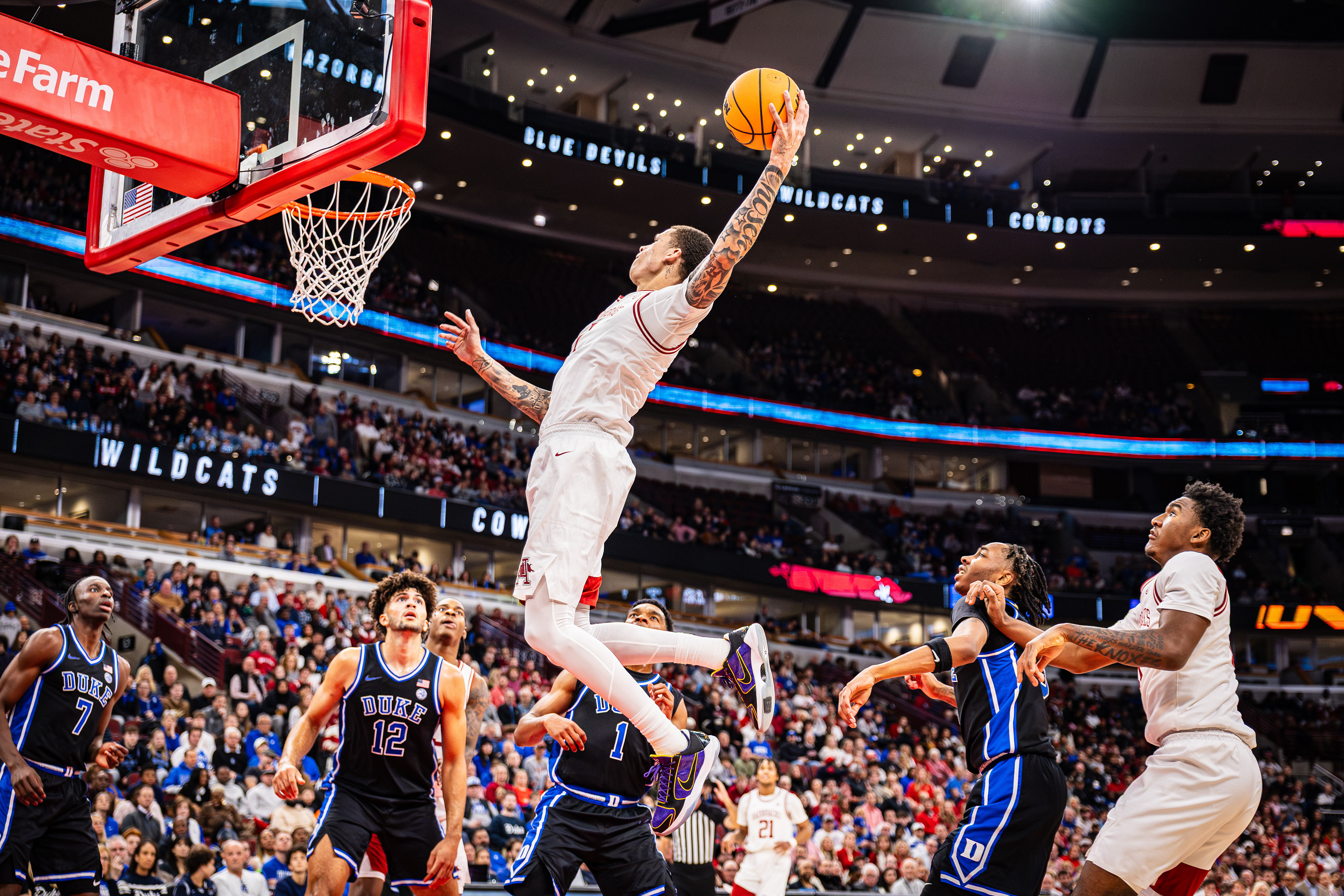Arkansas basketball player Trevon Brazile goes in for a dunk in the CBS Sports Thanksgiving Classic game against Duke, at the United Center, located in Chicago, Illinois, on November 27, 2025.