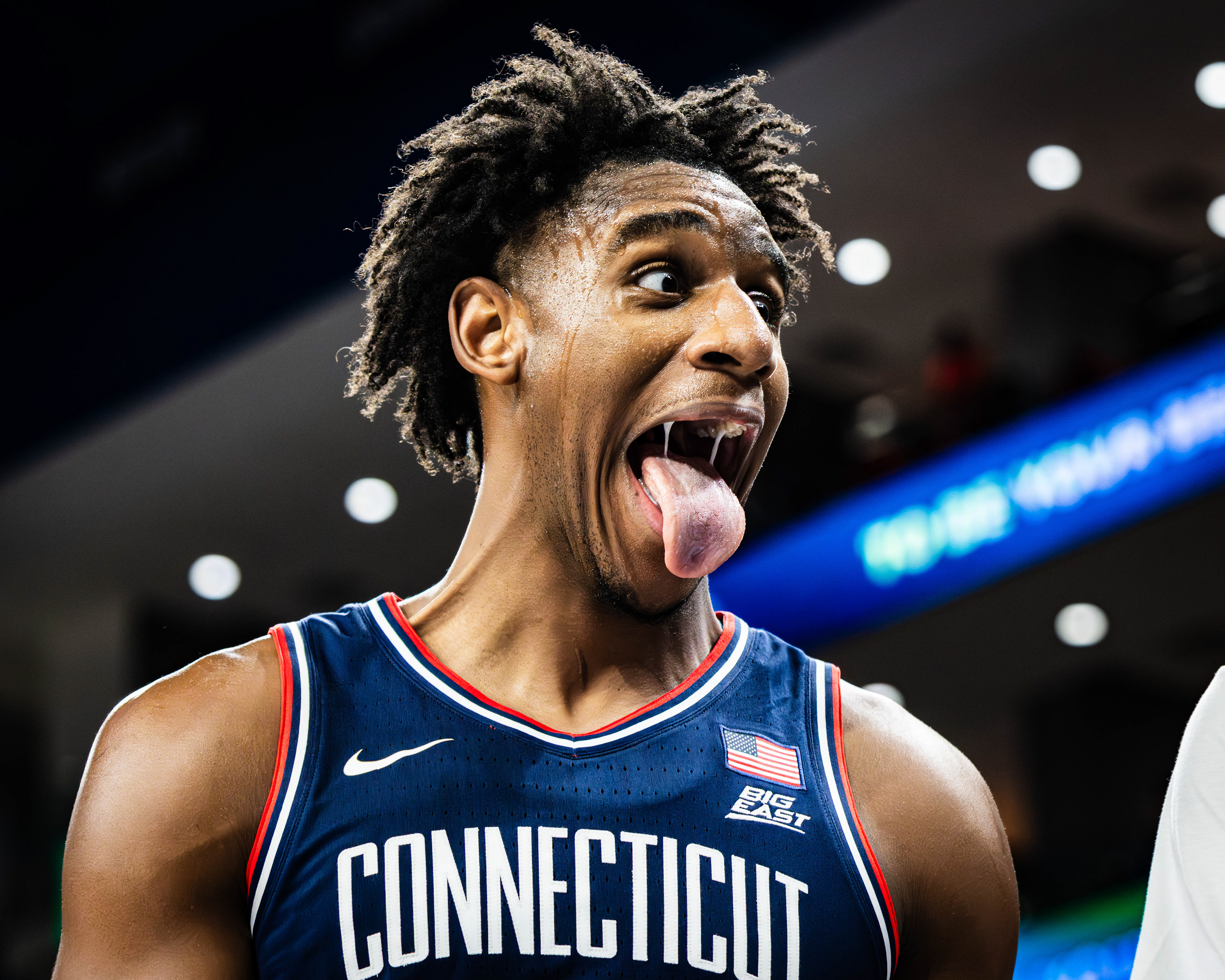 UConn basketball player Tarris Reed Jr. celebrates on the bench after a successful play in the game against DePaul, at Wintrust Arena, located in Chicago, Illinois, on December 21, 2025.