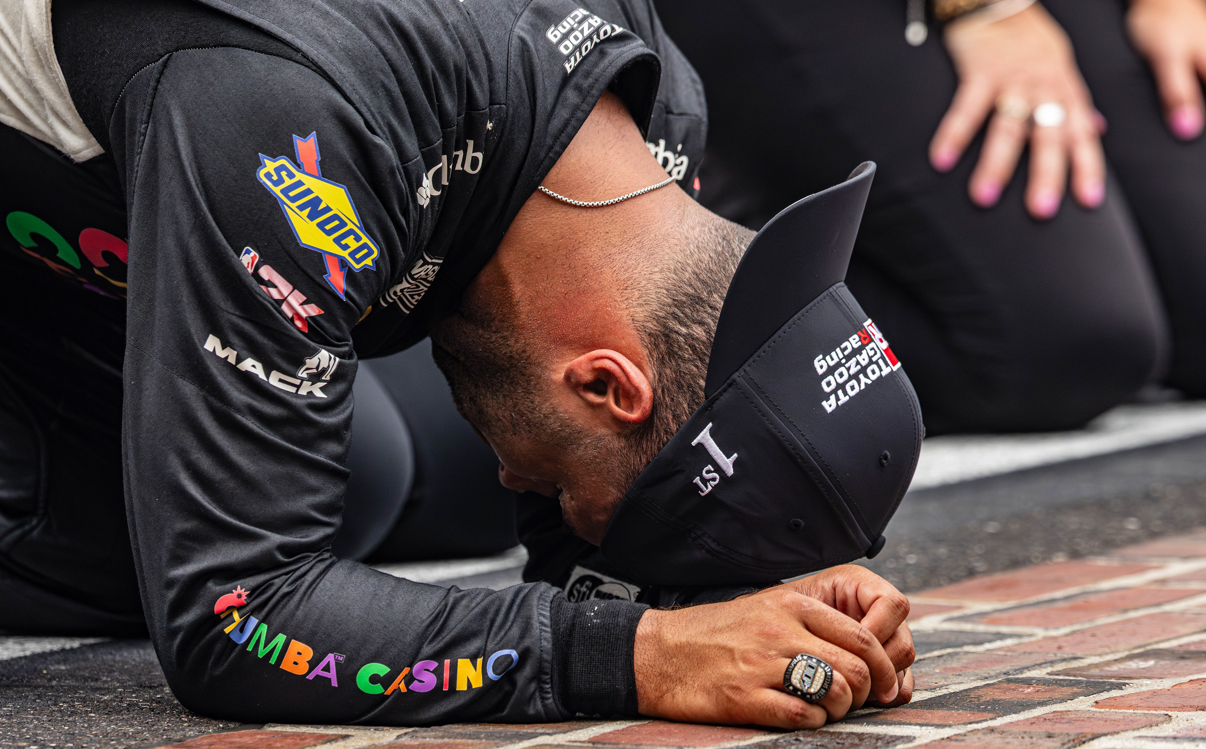 Bubba Wallace, driver of the No. 23 Toyota Camry for 23XI Racing in the NASCAR Cup Series, celebrates winning the Brickyard 400 on the start/finish line of the Indianapolis Motor Speedway, located in Speedway, Indiana, on July 27, 2025.