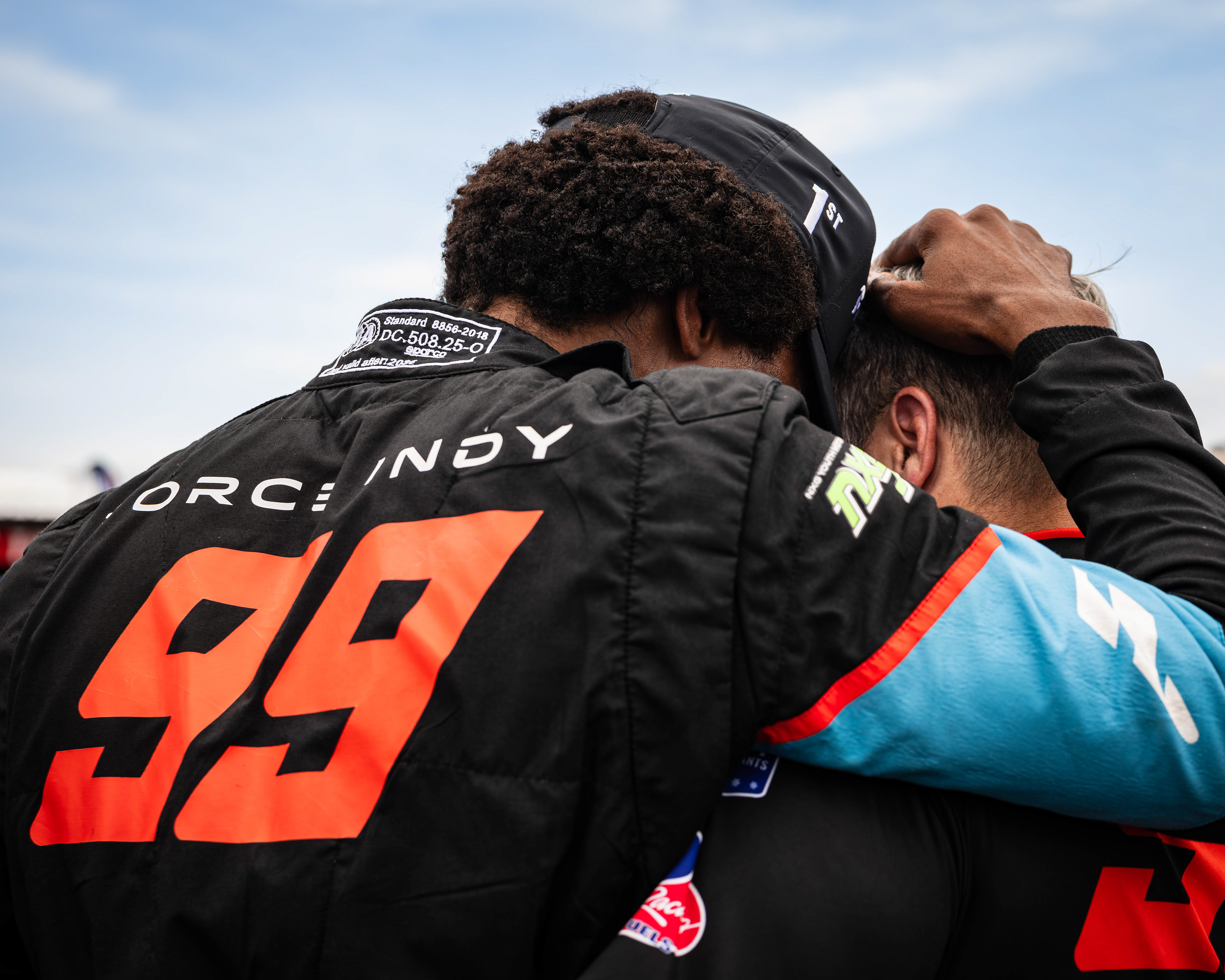 Myles Rowe, driver of the No. 99 Force Indy for Abel Motorsports, hugs a crew member after winning his third career INDY NXT race. Rowe drove to the victory from 24th, the last position on the grid, the furthest back in series history, at World Wide Technology Raceway, on June 7, 2026.