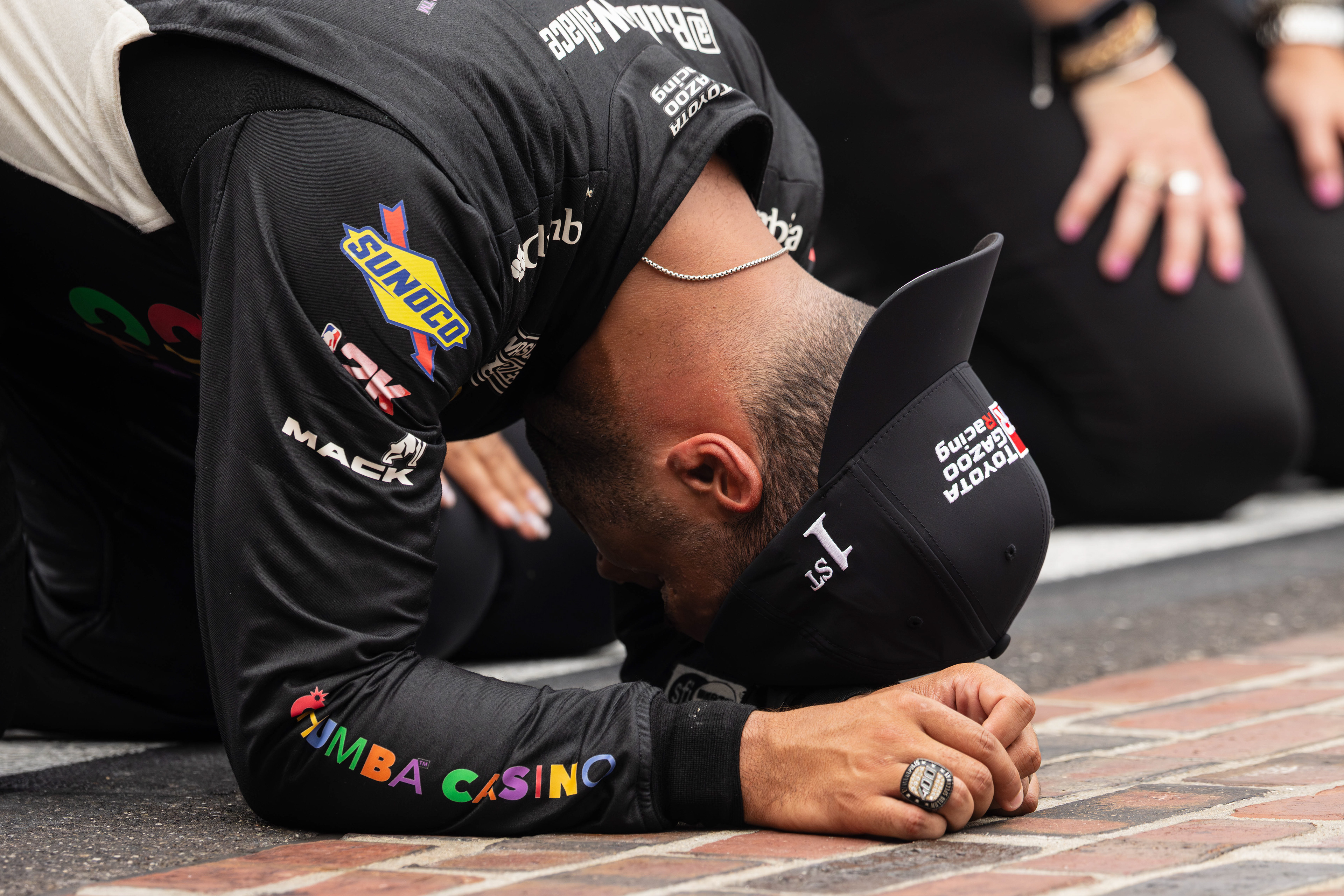 Bubba Wallace, driver of the No. 23 Toyota Camry for 23XI Racing in the NASCAR Cup Series, celebrates winning the Brickyard 400 on the start/finish line of the Indianapolis Motor Speedway, located in Speedway, Indiana, on July 27, 2025.