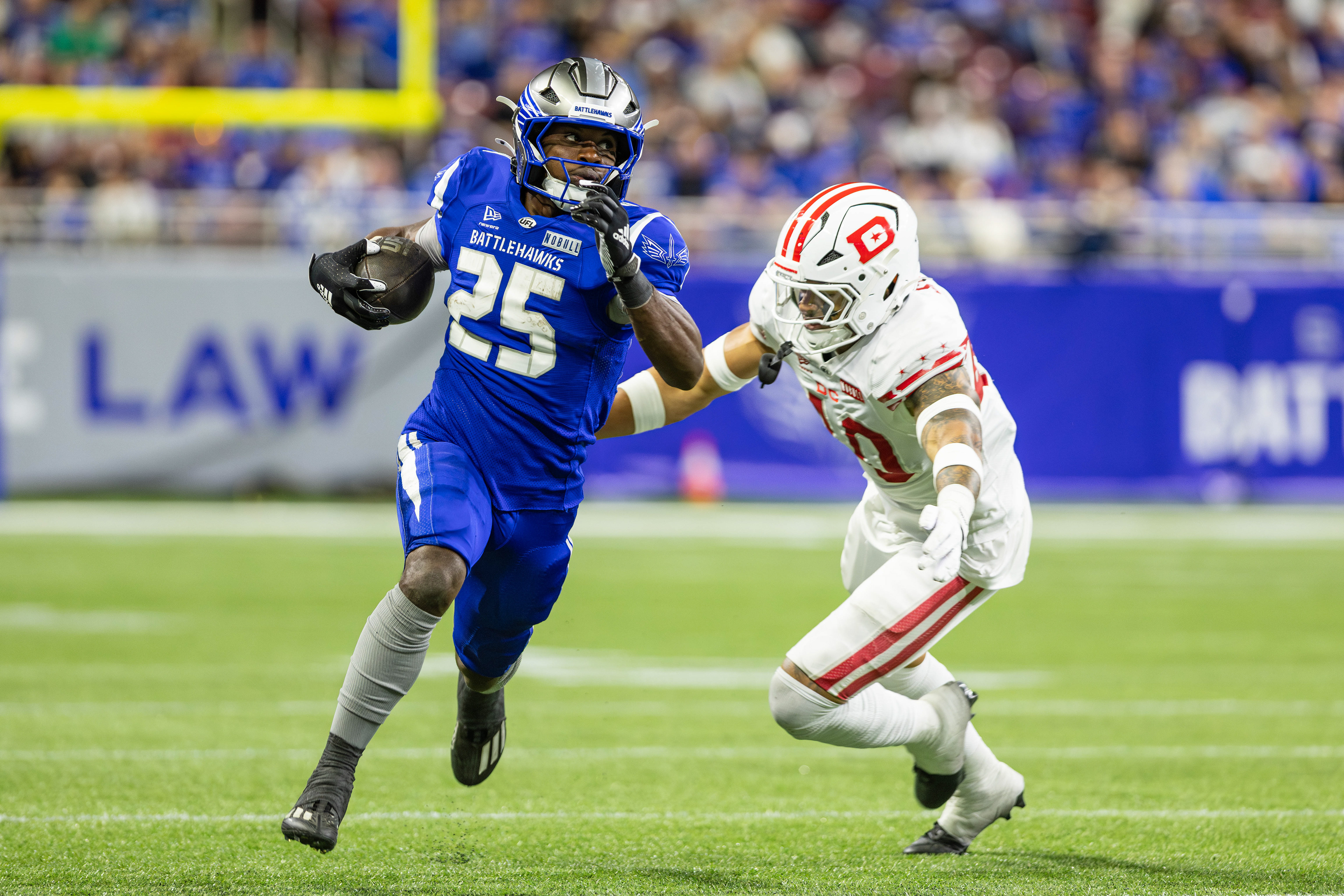 St. Louis Battlehawks running Kevon Latulas rushes the football up the field against linebacker Brandon Smith in the United Football League game against the D.C Defenders, at the Dome at America's Center, in St. Louis, Missouri, on March 28, 2026. 