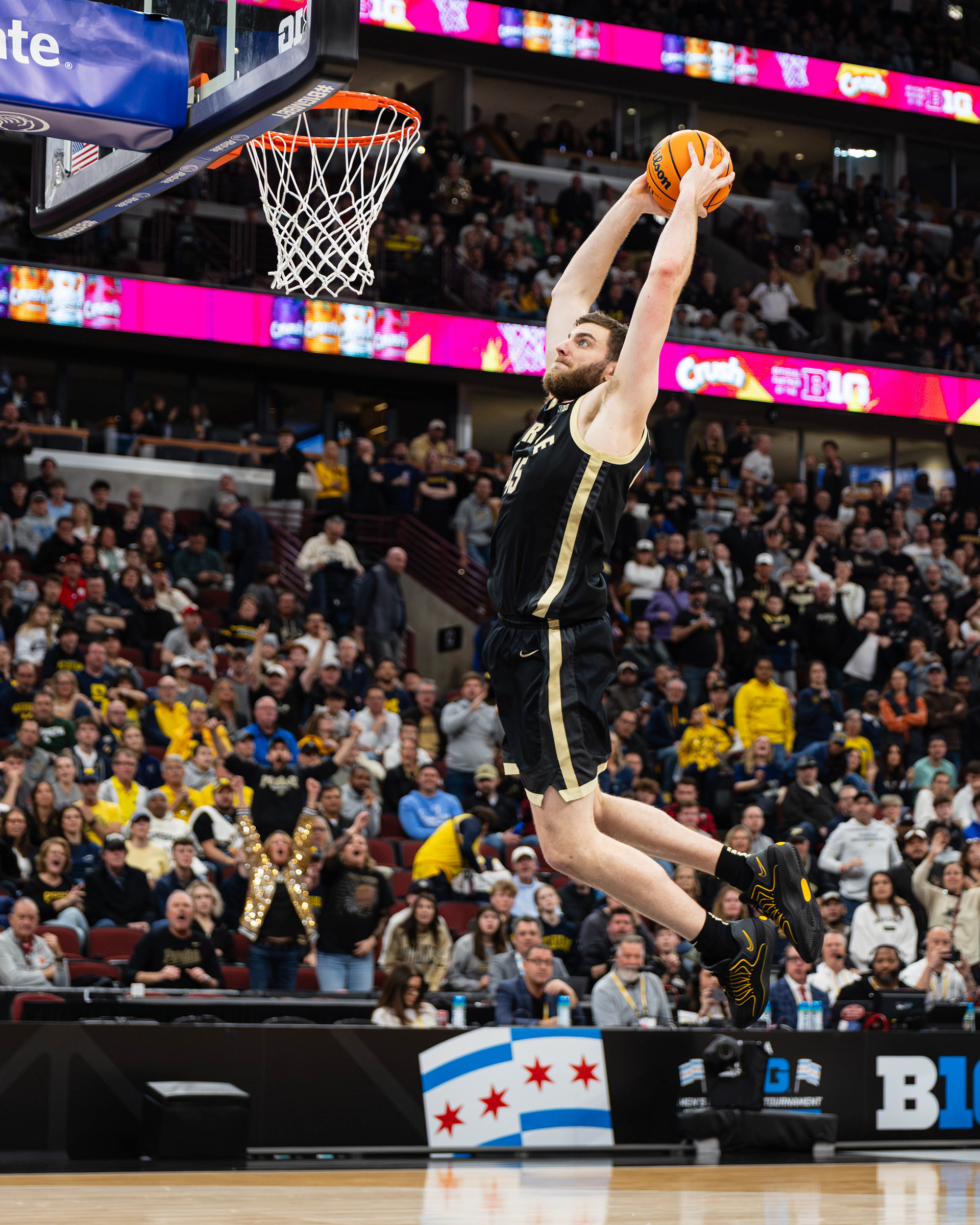 Purdue basketball player Oscar Cluff goes in for a dunk in the championship game of the 2026 TIAA Big Ten Men's Basketball Tournament against Michigan, at the United Center, located in Chicago, Illinois, on March 15, 2026.