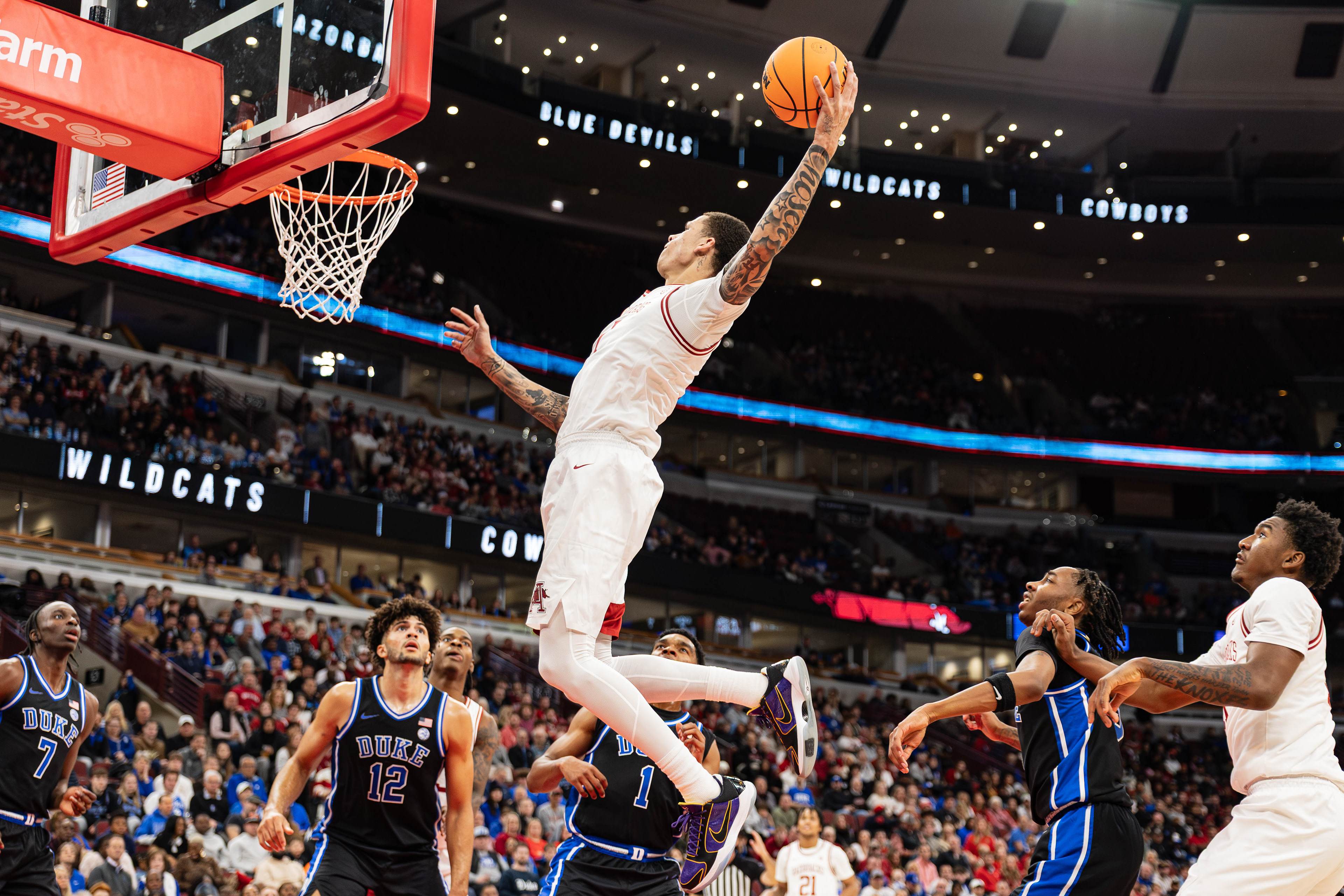 Arkansas basketball player Trevon Brazile goes in for a dunk in the CBS Sports Thanksgiving Classic game against Duke, at the United Center, located in Chicago, Illinois, on November 27, 2025.