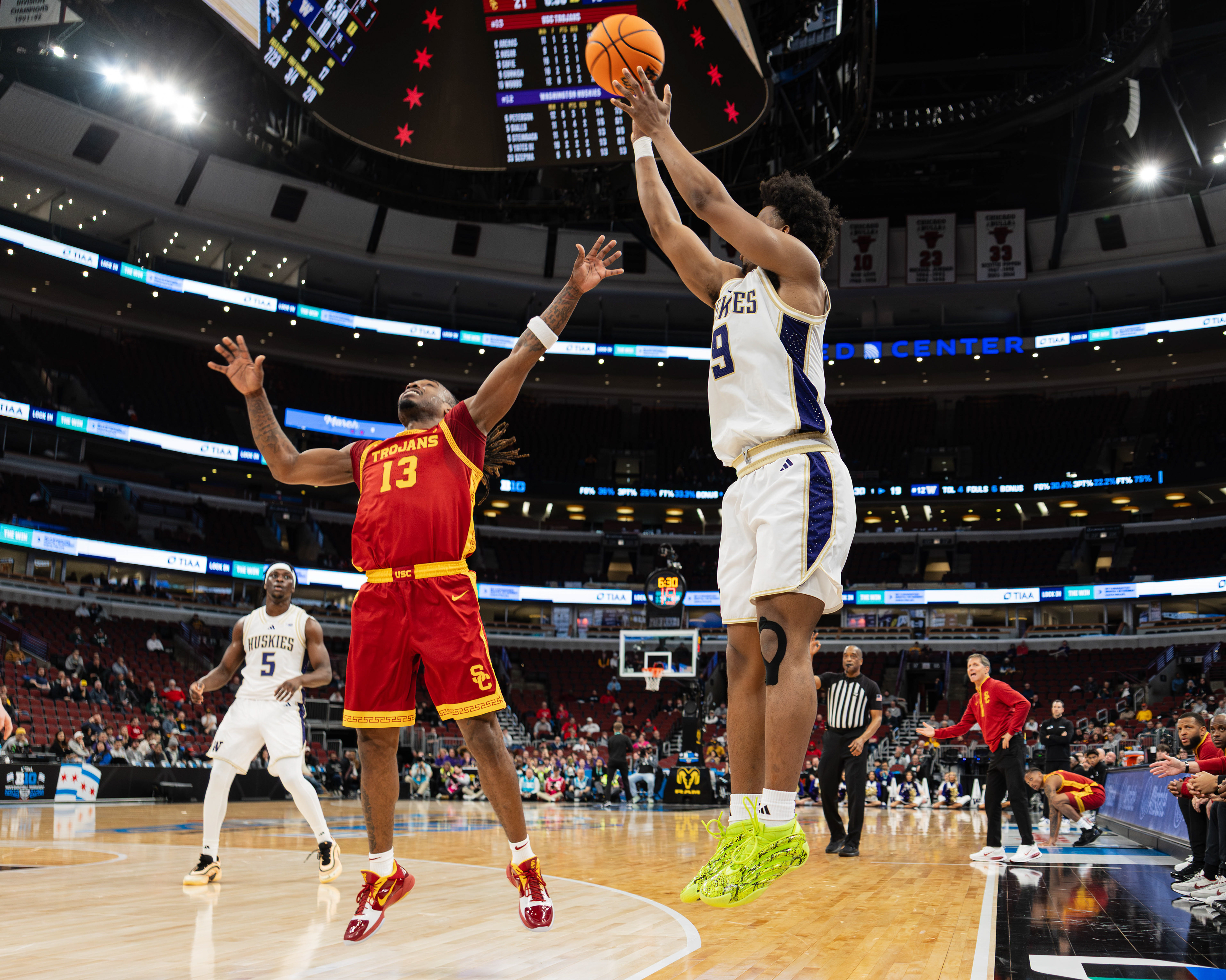 University of Washington basketball player Wesley Yates II shoots a three-pointer over USC's Kam Woods in the second round game of the 2026 TIAA Big Ten Men's Basketball tournament game at the United Center, in Chicago, Illinois, on March 11, 2026.