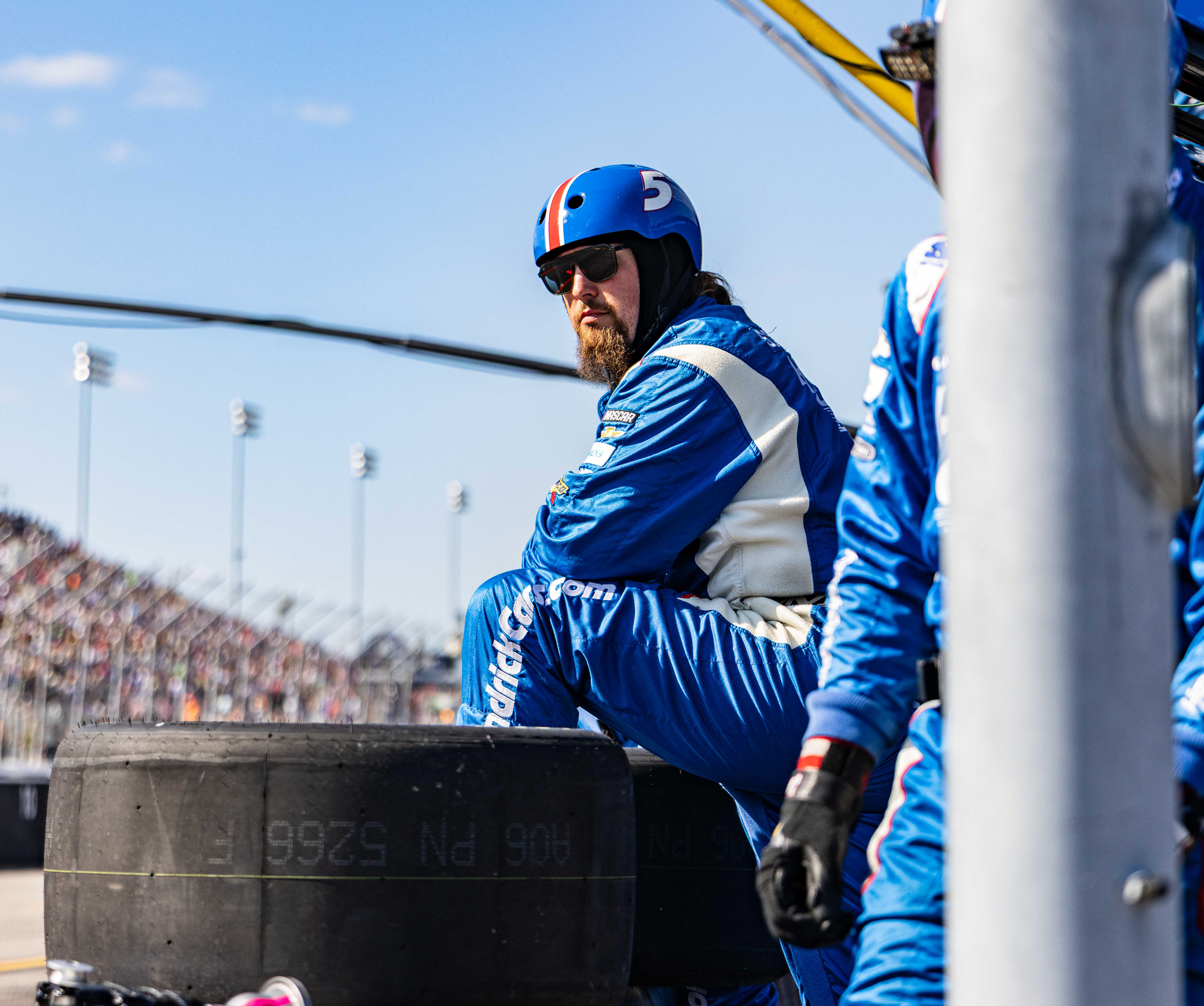 A pit crew member for Kyle Larson, driver in the NASCAR Cup Series, waits for a pit stop in the Enjoy Illinois 300 race, at the World Wide Technology Raceway, in Madison, Illinois, on September 7, 2025.