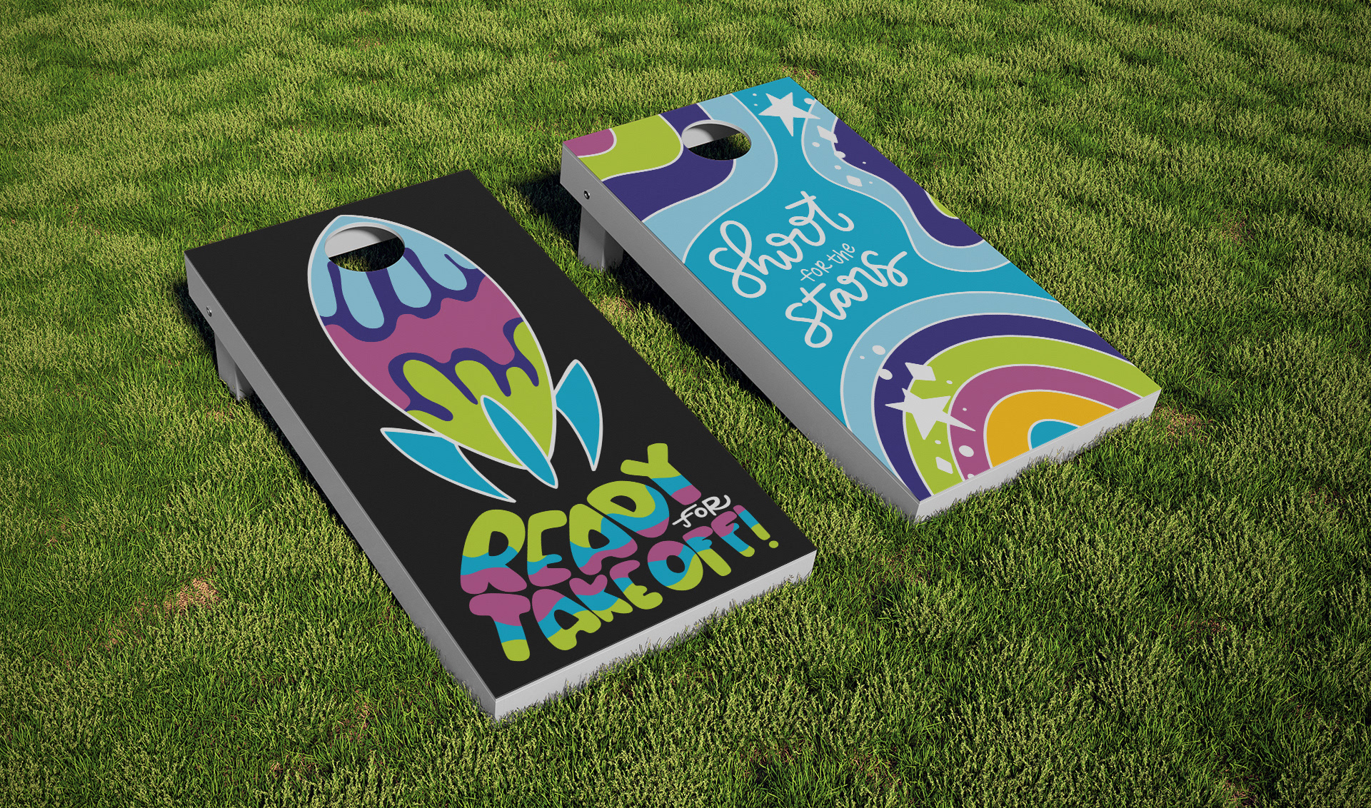 Mockup of two cornhole games with illustrations and the text "Ready for take off!" and "Shoot for the stars"