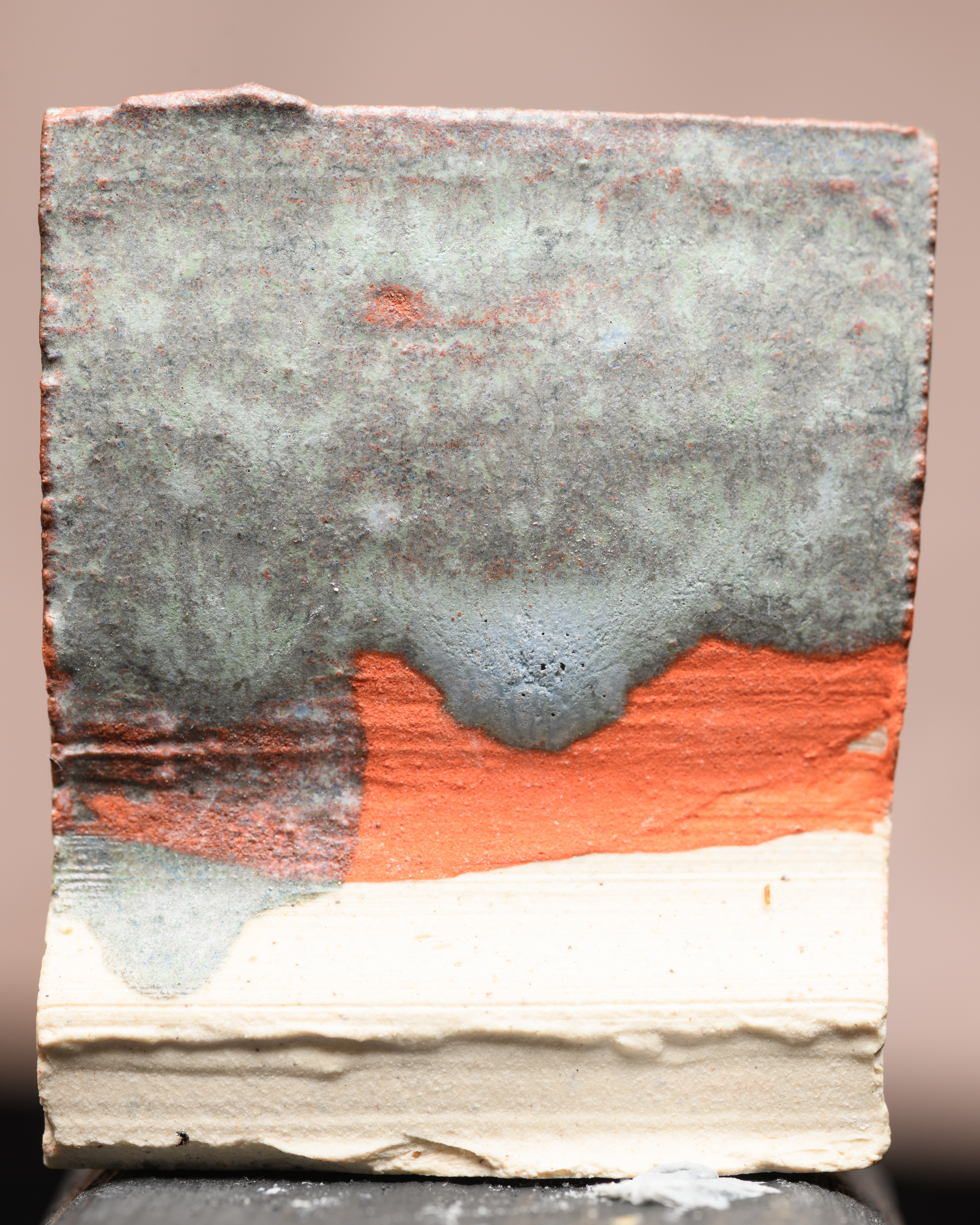 Bluestone on studio orange underglaze