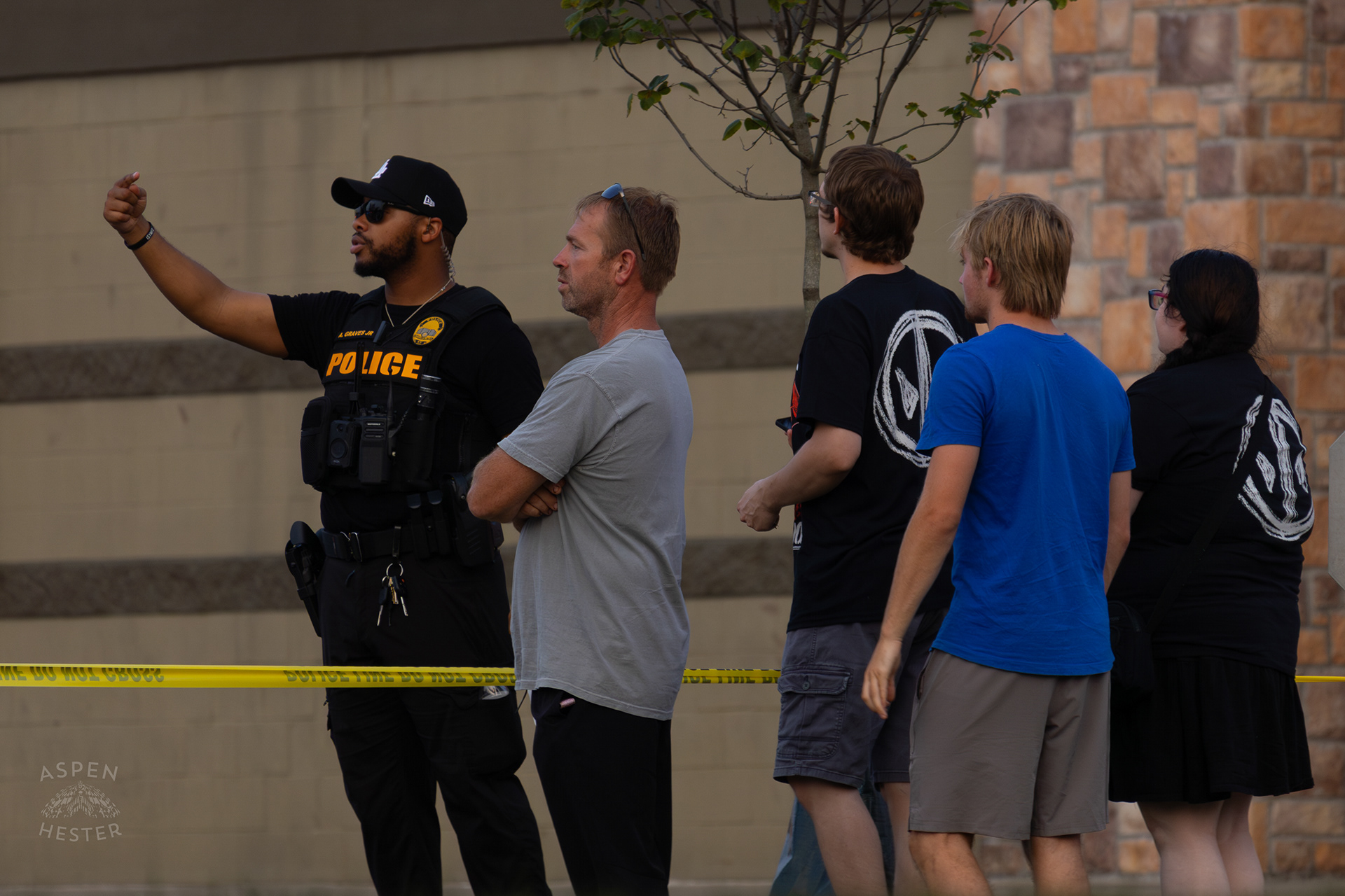 Witnesses Describing What They Saw to A Police Officer At The Scene Where A Man Shot Himself in The Head During A Police Stop Outside Mall St. Matthews. July 27th, 2024/Aspen Hester