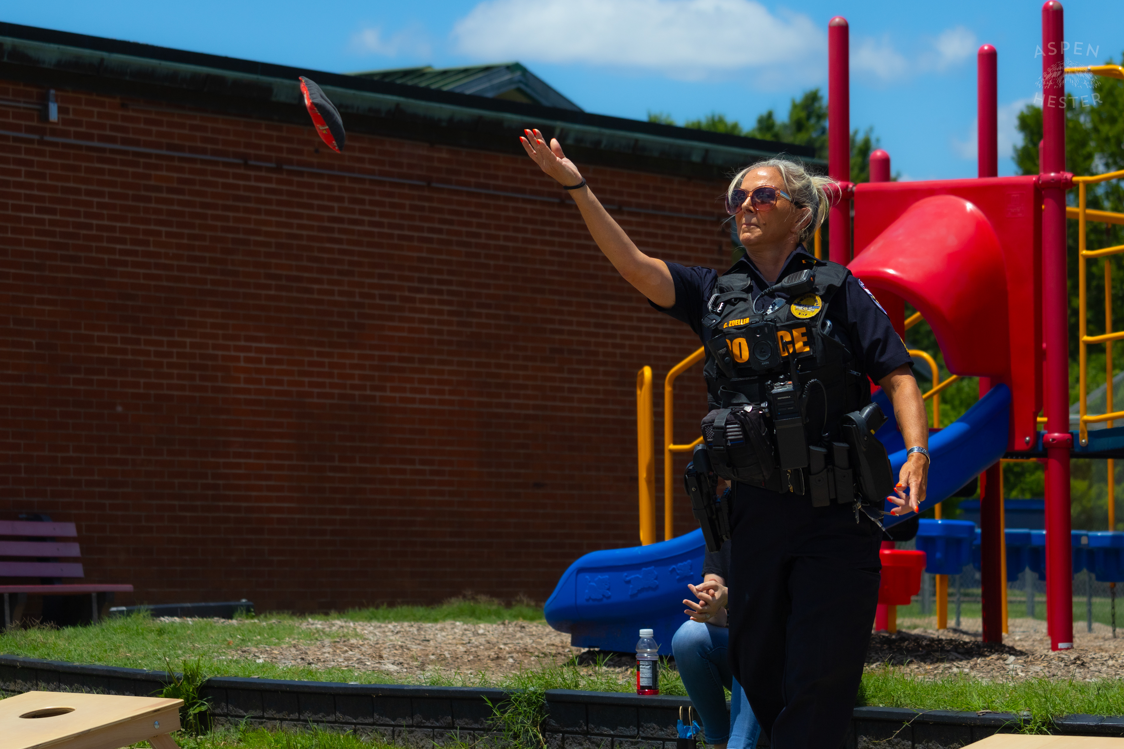 LMPD Officer Carmine Zoeller Participates in "Cornhole with Cops" Event. July 6th, 2024/Aspen Hester