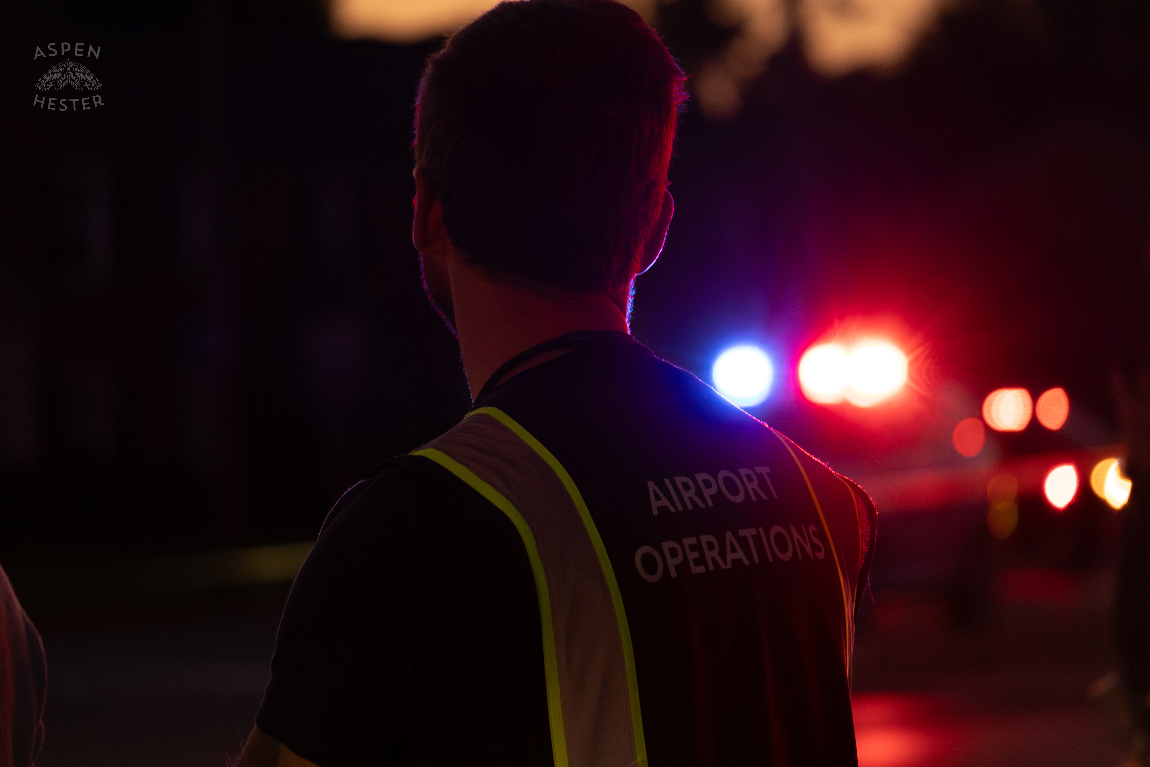 Airport Authorities Watching Over The Scene Where A Piper Cherokee Plane Crash Landed, Taking Out Utility Poles, and Hitting A Car on Breckenridge Lane and Kresge Way. October 11th, 2024/Aspen Hester 