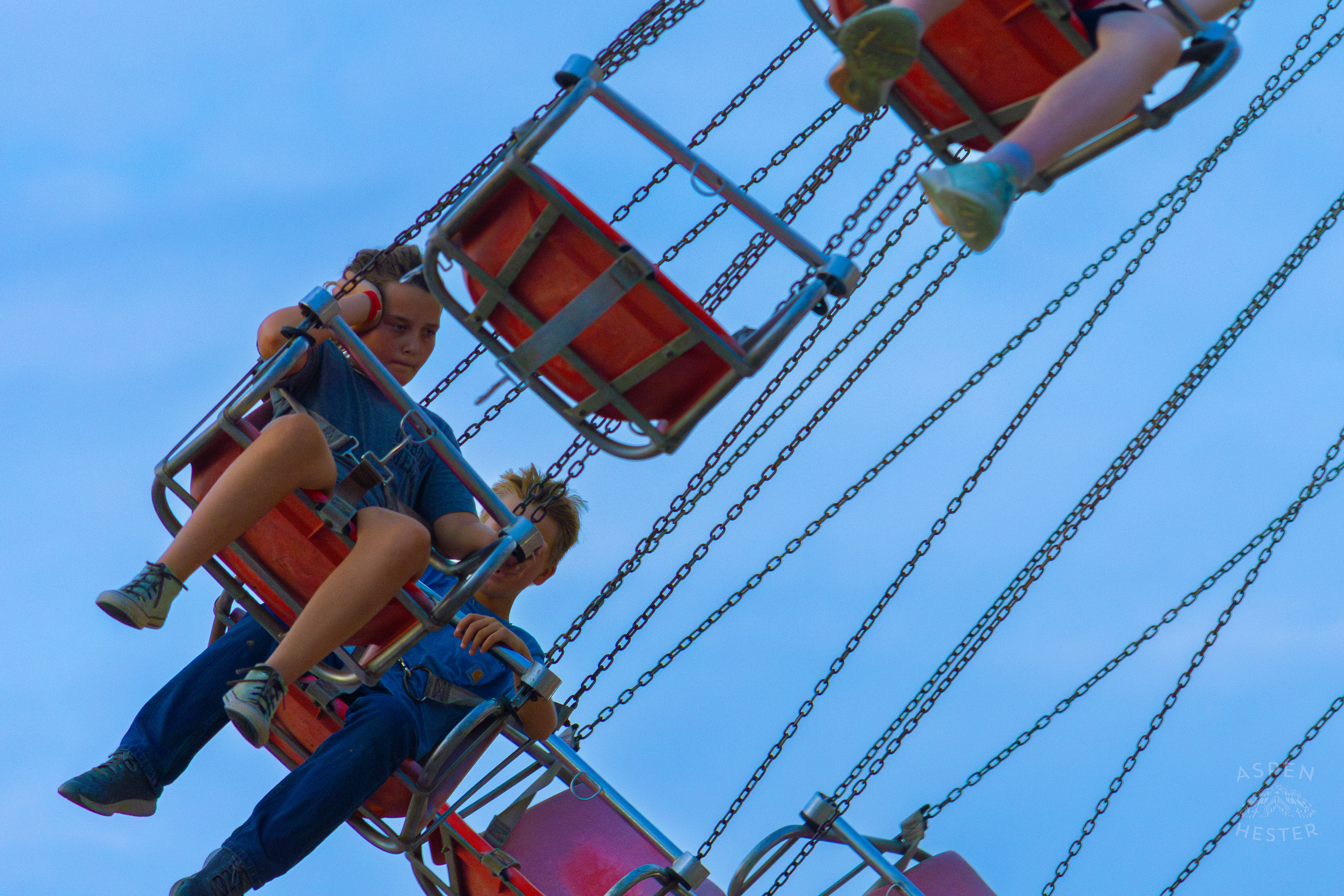Very Unimpressed Kids Ride The Swings at The 120th Kentucky State Fair. July 15th, 2024/Aspen Hester